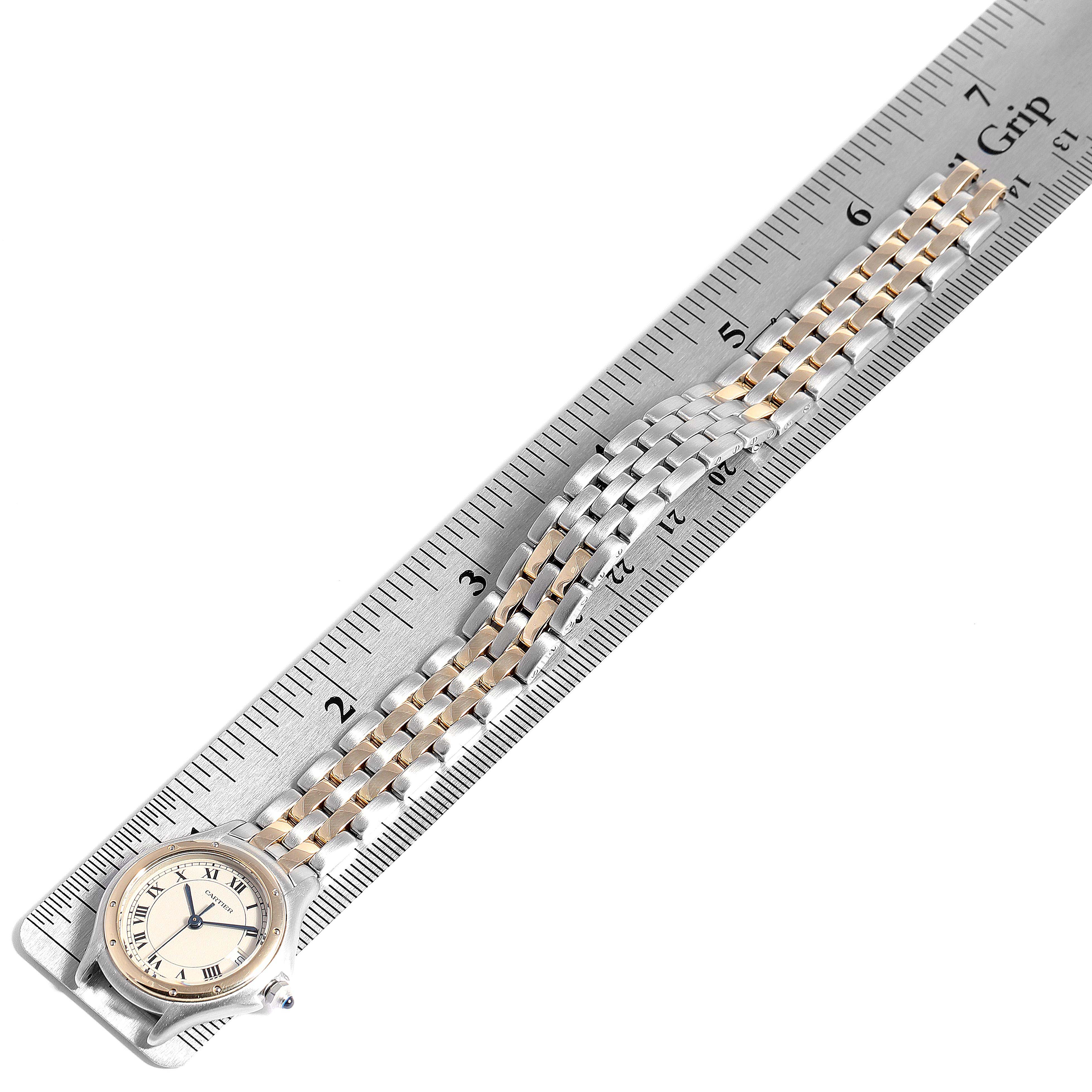 The image shows the Cartier Panthere W35005B6 Women
s Steel and Gold (two tone) Silver Dial W35005B6 Women
s Steel and Gold (two tone) Silver Dial watch laying flat against a ruler, showcasing the face and bracelet.