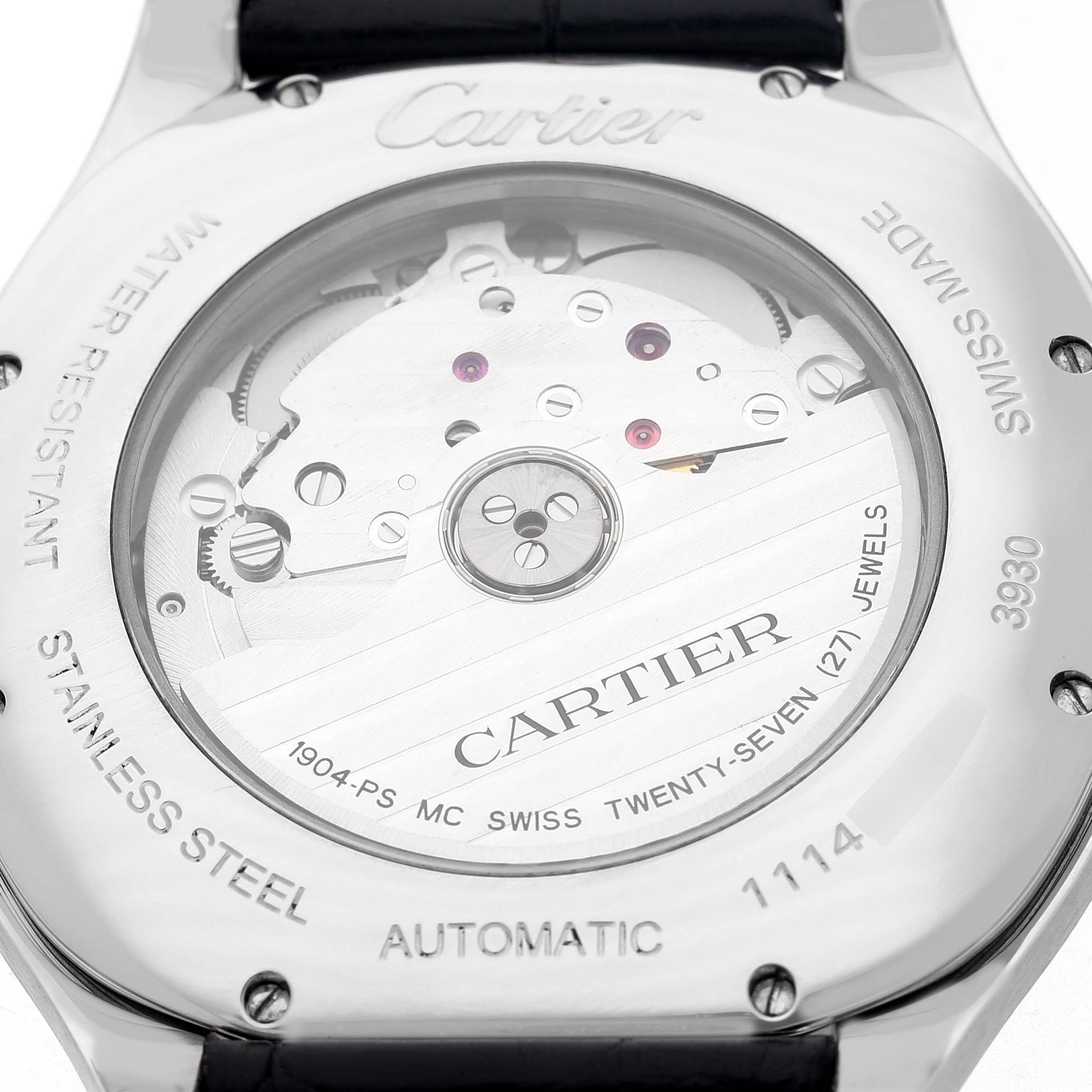 The image shows the back of a Drive de Cartier watch, highlighting the movement and engravings.