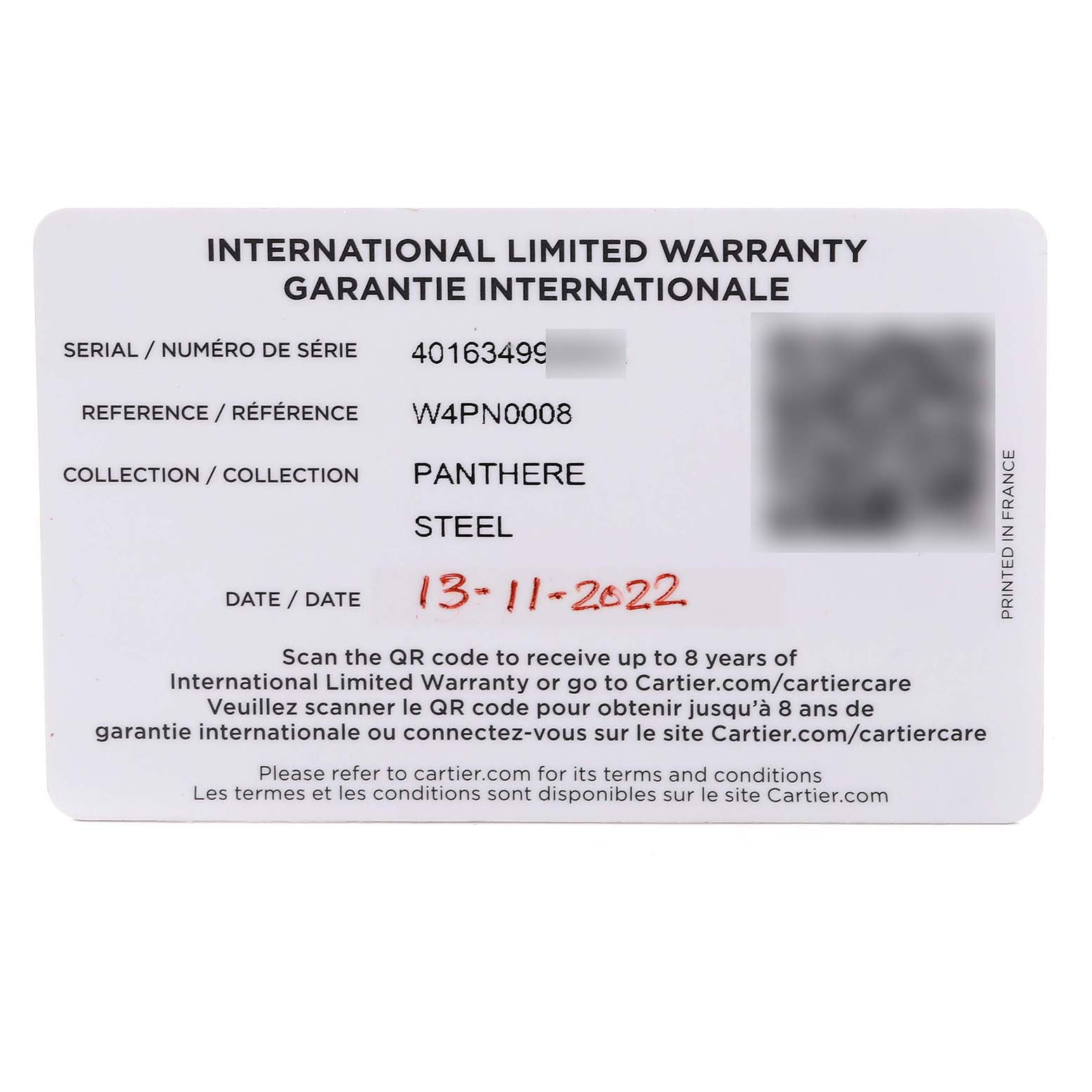 This image shows the International Limited Warranty card for a Cartier Panthere W4PN0008 Women
s Stainless Steel Silver Dial W4PN0008 Women
s Stainless Steel Silver Dial model watch from a top-down angle.