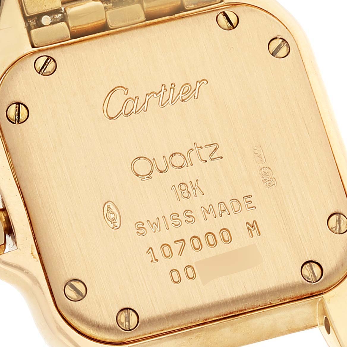 The image shows the back case of a Cartier Panthere W25022B9 Women's Yellow Gold Silver Dial W25022B9 Women's Yellow Gold Silver Dial watch, highlighting inscriptions and screw details.