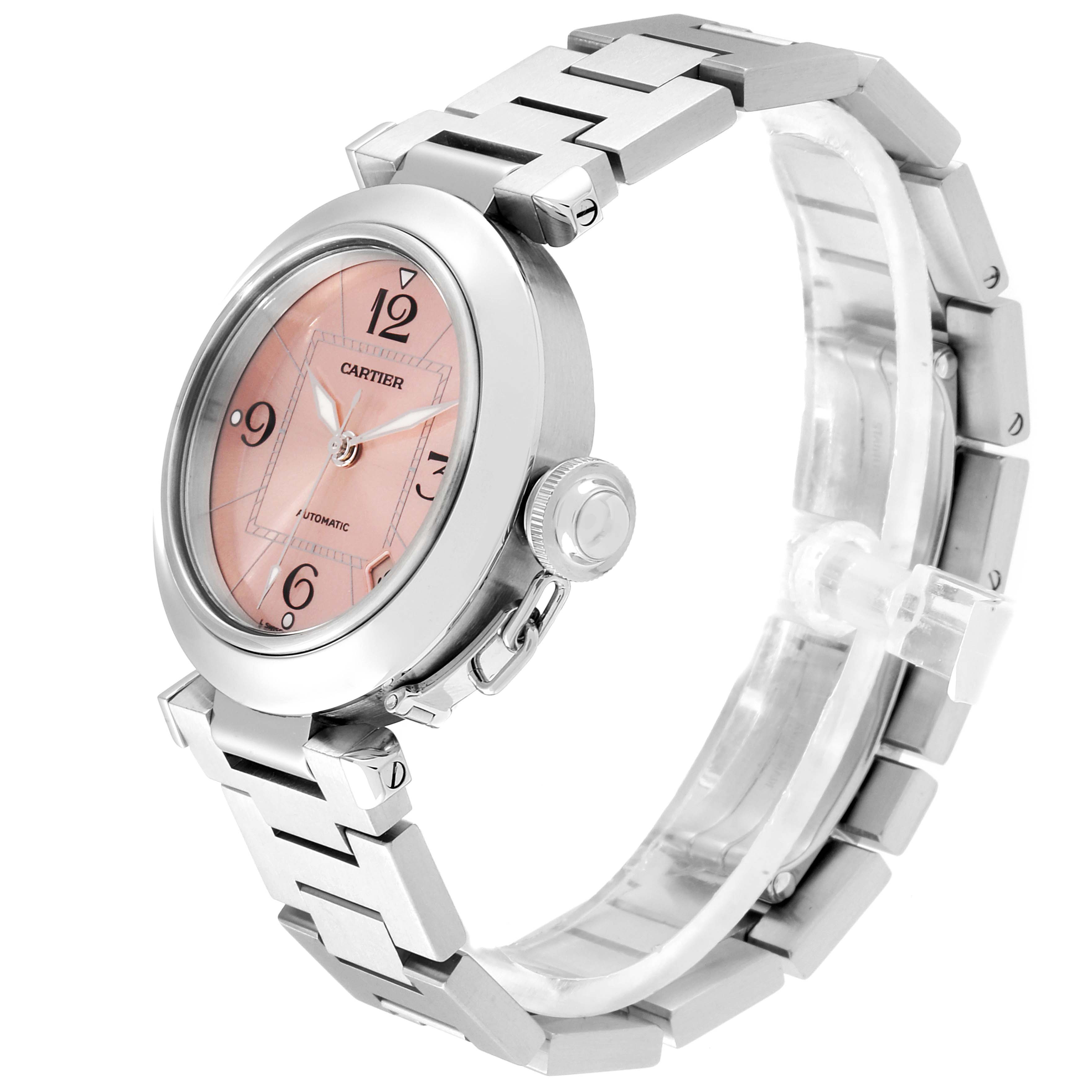 The Cartier Pasha W31075M7 Women's Stainless Steel Pink Dial W31075M7 Women's Stainless Steel Pink Dial watch is shown at a three-quarter angle, highlighting its face, bezel, crown, and metal bracelet.