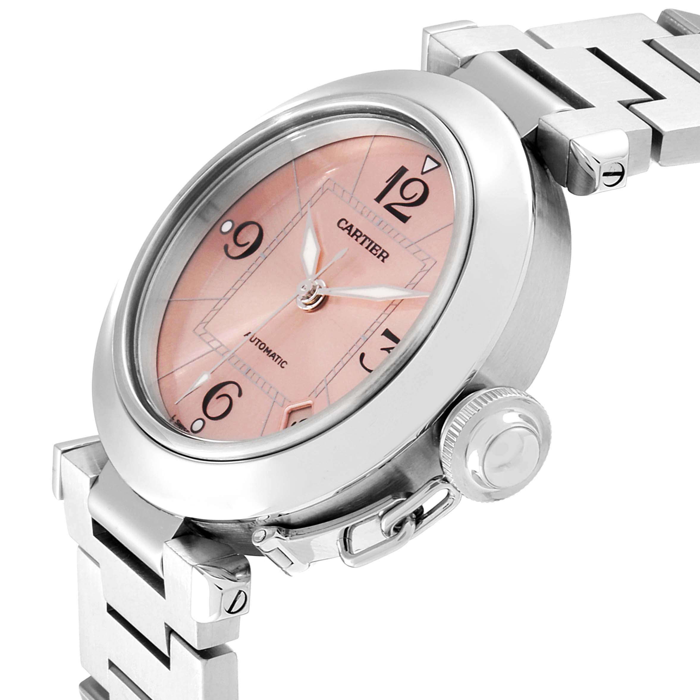 The image shows a Cartier Pasha W31075M7 Women's Stainless Steel Pink Dial W31075M7 Women's Stainless Steel Pink Dial watch at a slight angle, highlighting the face, bezel, crown, and part of the bracelet.