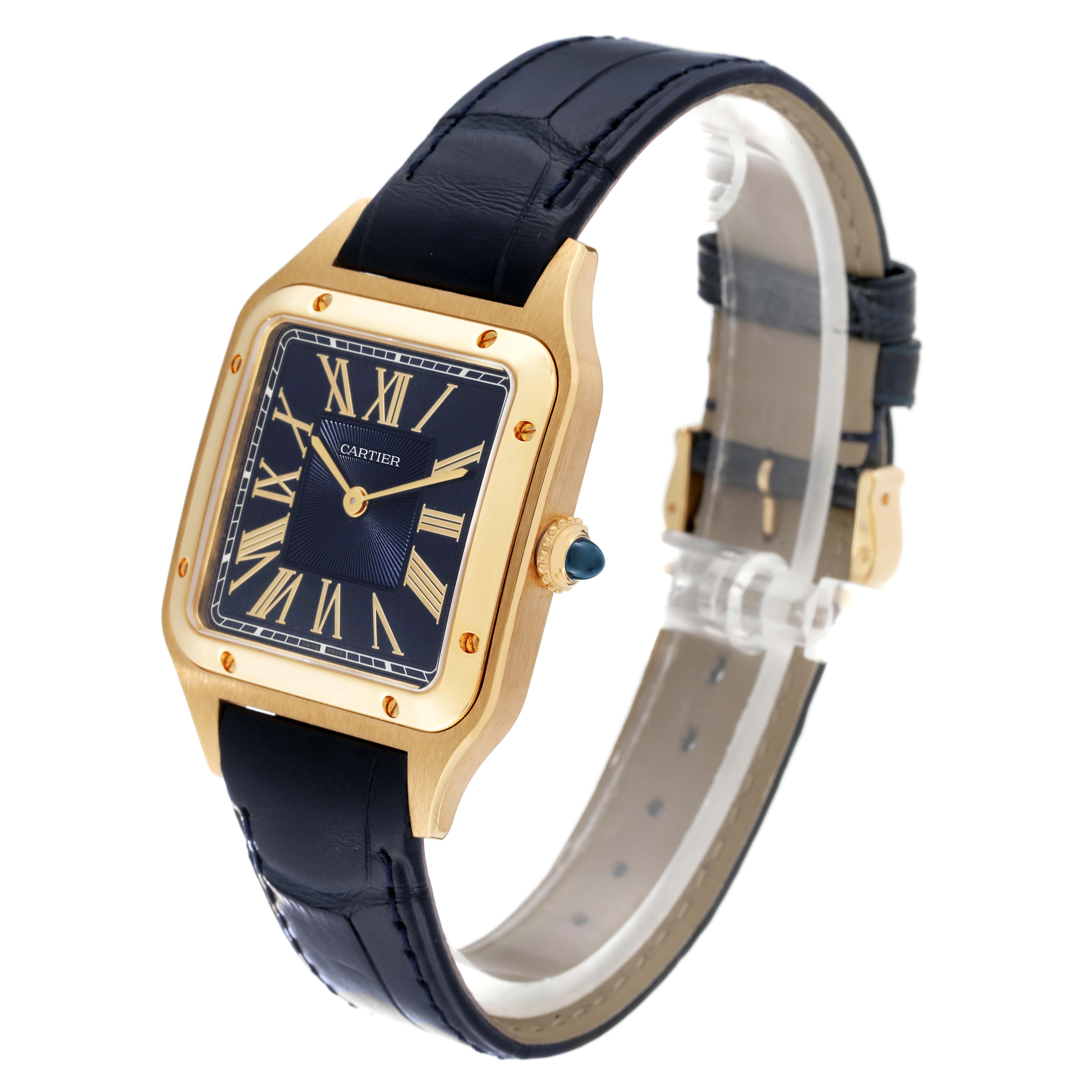 This Cartier Santos Dumont WGSA0077 Men
s Yellow Gold Blue Dial WGSA0077 Men
s Yellow Gold Blue Dial watch is shown at a slight angle highlighting the face, case, crown, and leather strap.