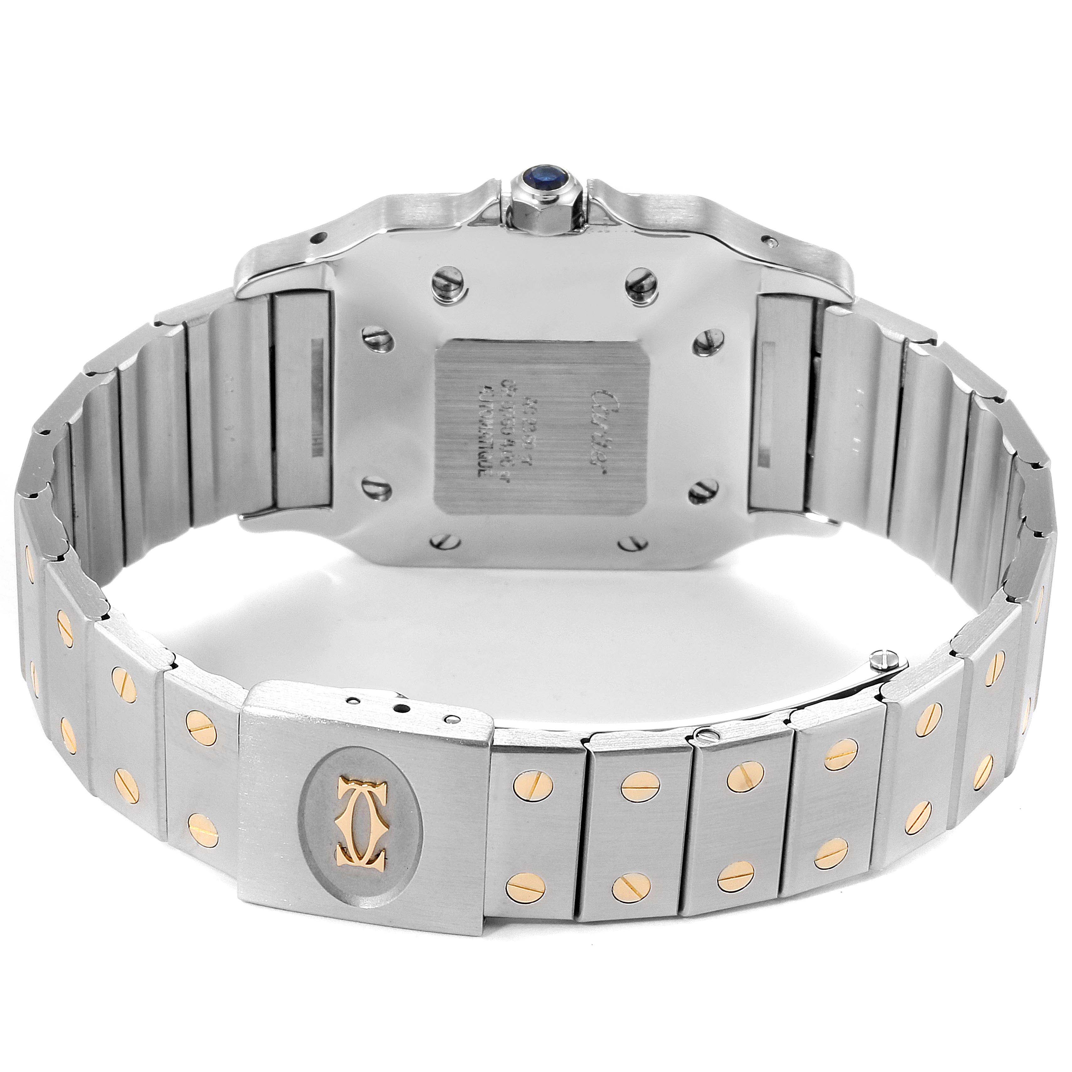 The image shows the back view of a Santos model watch by Cartier, focusing on the strap and case back.