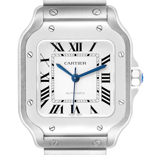 The image shows a frontal view of a Cartier Santos WSSA0029 Men's Stainless Steel Silver Dial watch, highlighting the dial, hands, and bezel with its distinctive screws.