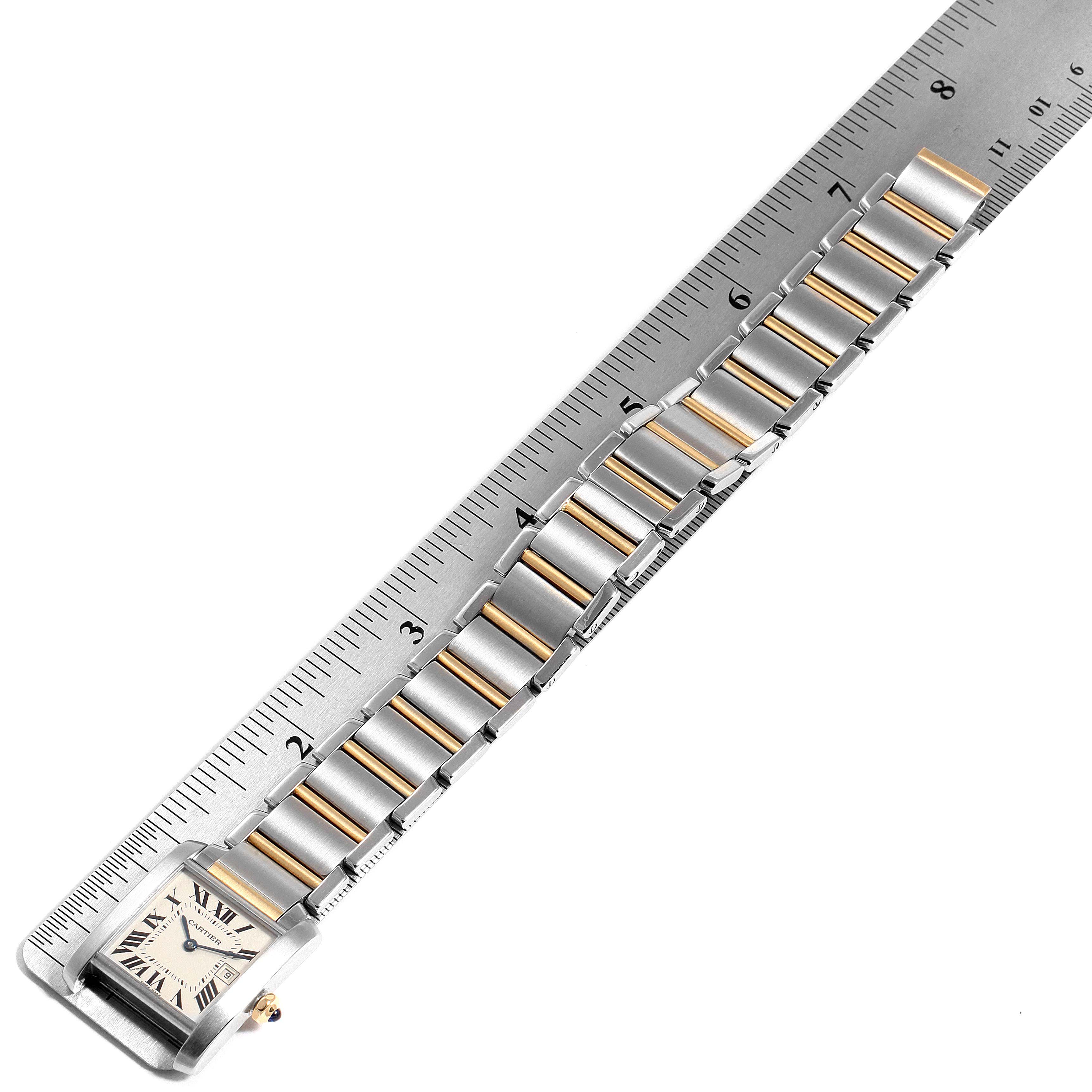 The image shows the Tank Francaise watch by Cartier from the top angle, focusing on the strap and part of the face.