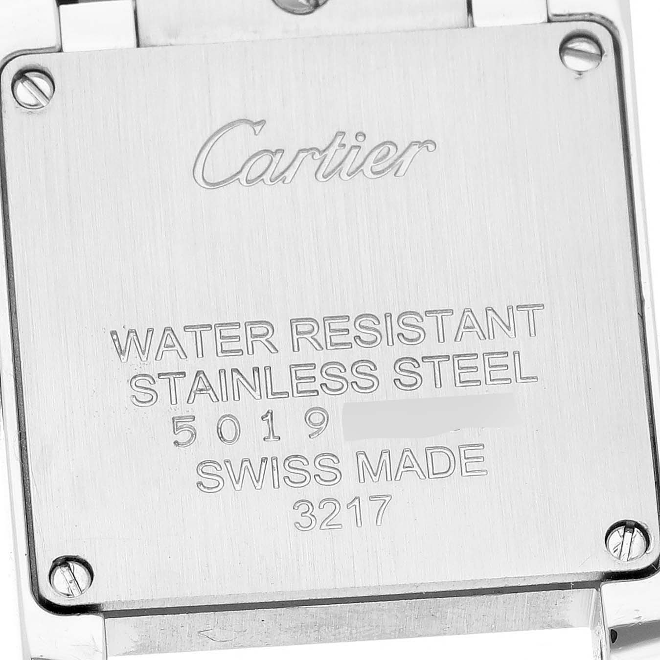 The image shows the back of a Cartier Tank Francaise W4TA0008 Women's Stainless Steel Silver Dial watch, displaying engravings about its water resistance, stainless steel material, and Swiss origin.