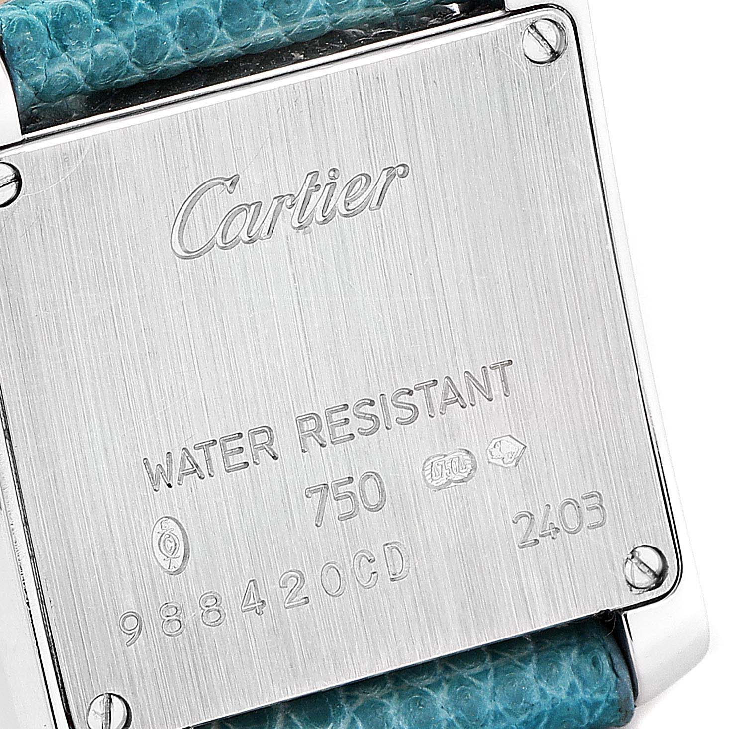 This image shows the back case of a Cartier Tank Française watch.