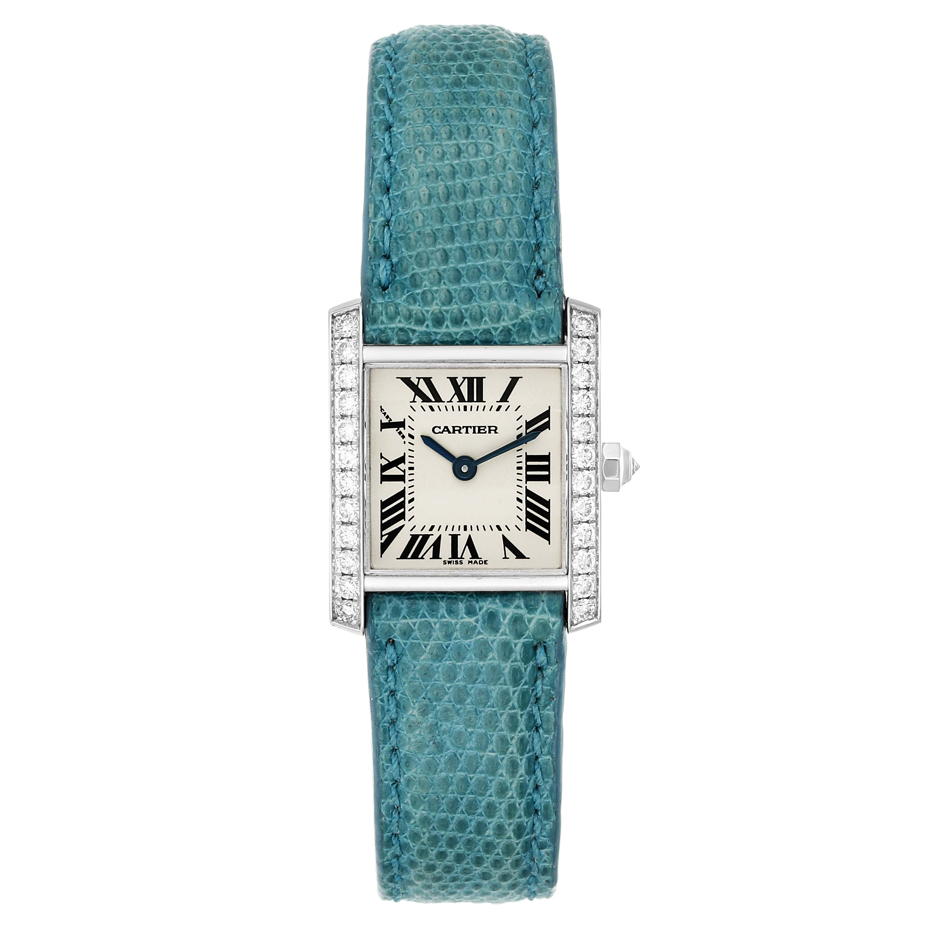 This Cartier Tank Francaise WE100231 Women
s White Gold Silver Dial WE100231 Women
s White Gold Silver Dial watch is shown from a top view, displaying its face, bezel, and teal-leather strap.
