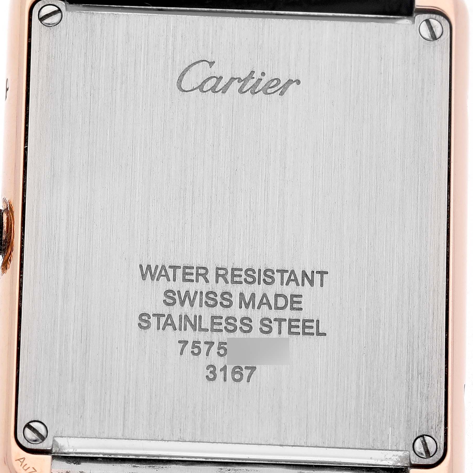 The image shows the back case of a Cartier Tank Solo W5200025 Men's Steel and Gold (two tone) Silver Dial watch, featuring brand engraving and model details.