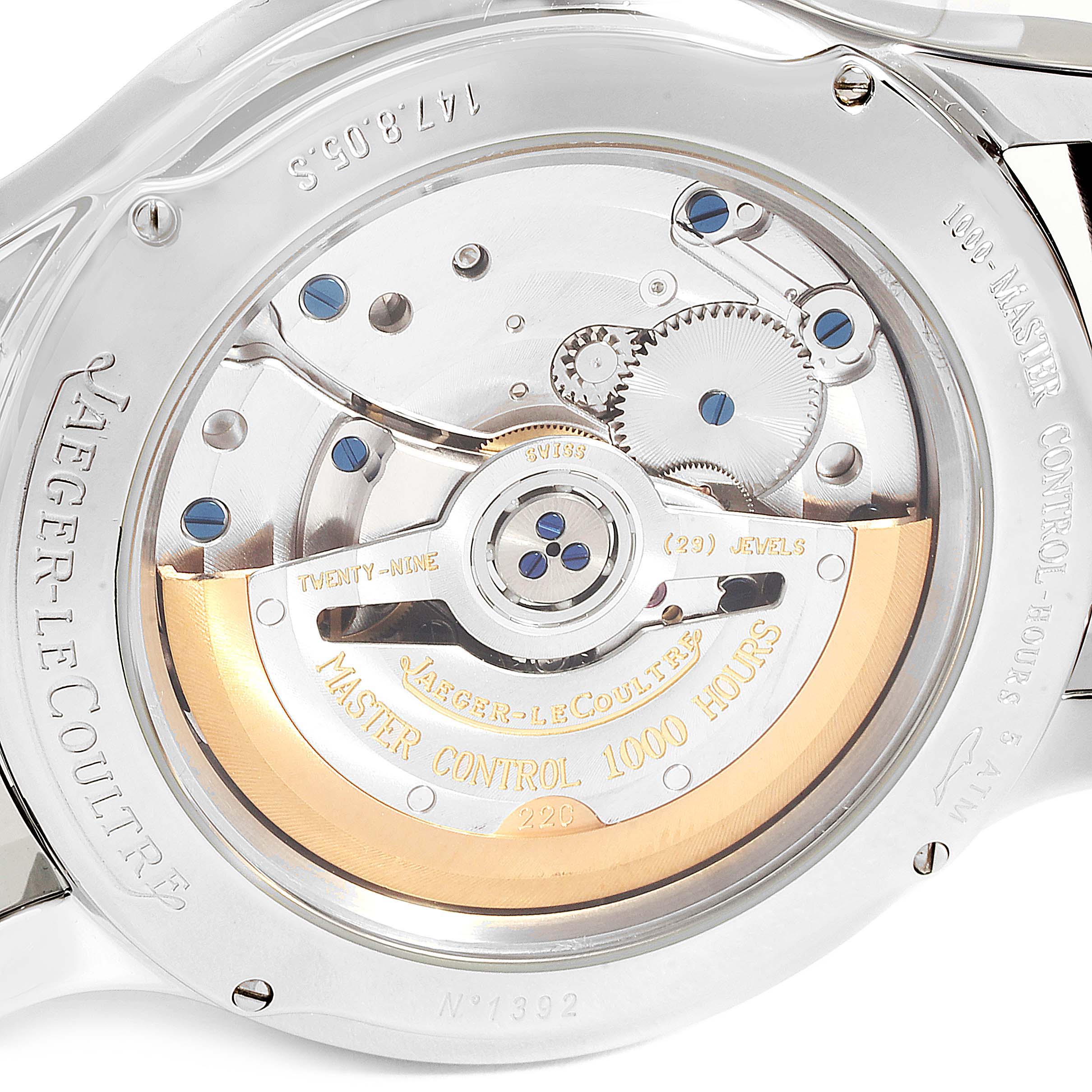 The image shows the case back and movement of a Jaeger-LeCoultre Master model watch.