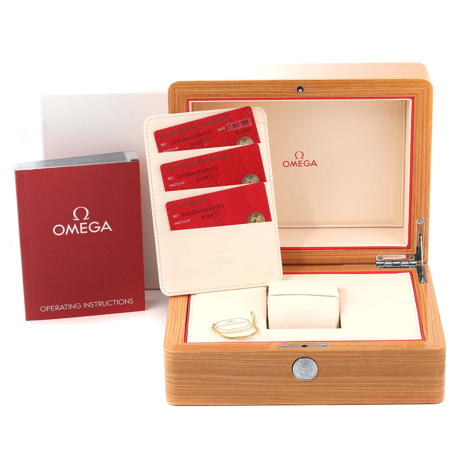 The image shows the Omega Planet Ocean 215.30.44.21.01.002 Men
s Stainless Steel Black Dial 215.30.44.21.01.002 Men
s Stainless Steel Black Dial watch box, with warranty cards, operating instructions, and accessories.