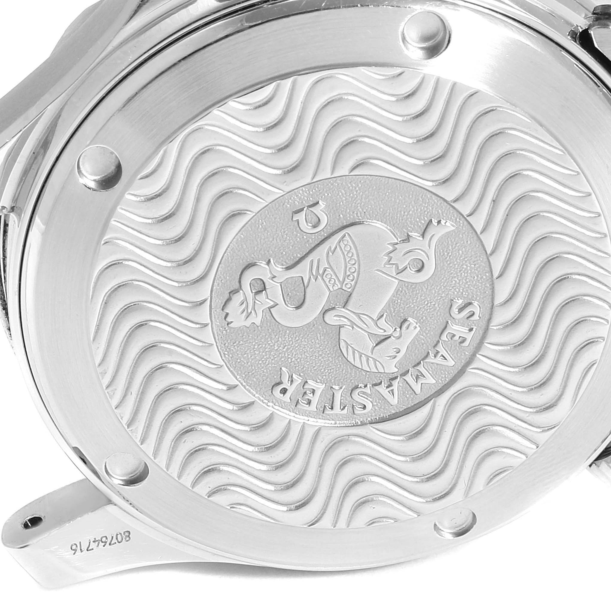 The image shows the back case of an Omega Seamaster 2453.50.00 Men's Steel and Gold (two tone) Black Dial 2453.50.00 Men's Steel and Gold (two tone) Black Dial watch with engraved wave patterns and the Seamaster logo.