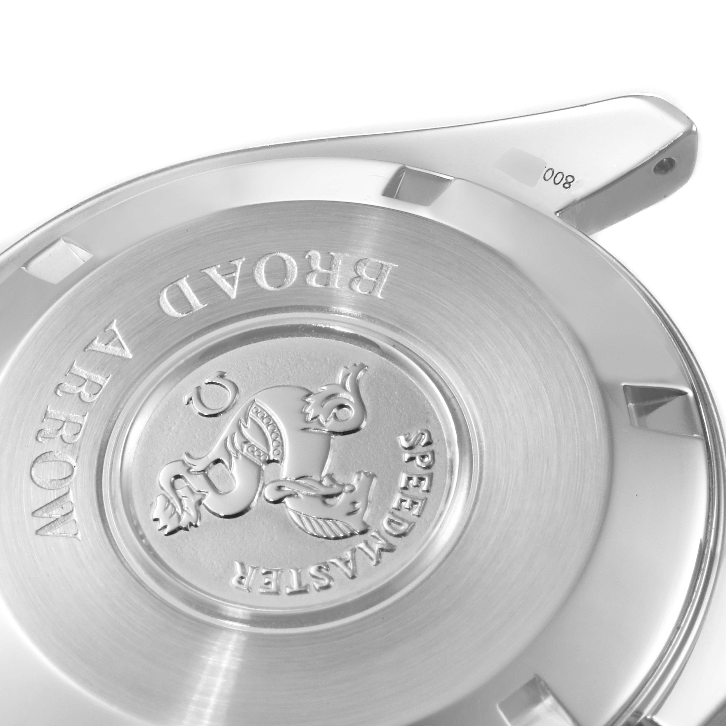 This image shows the back case of an Omega Speedmaster 3551.20.00 Men's Stainless Steel White Dial 3551.20.00 Men's Stainless Steel White Dial Broad Arrow watch, captured at an angle to highlight its engravings.