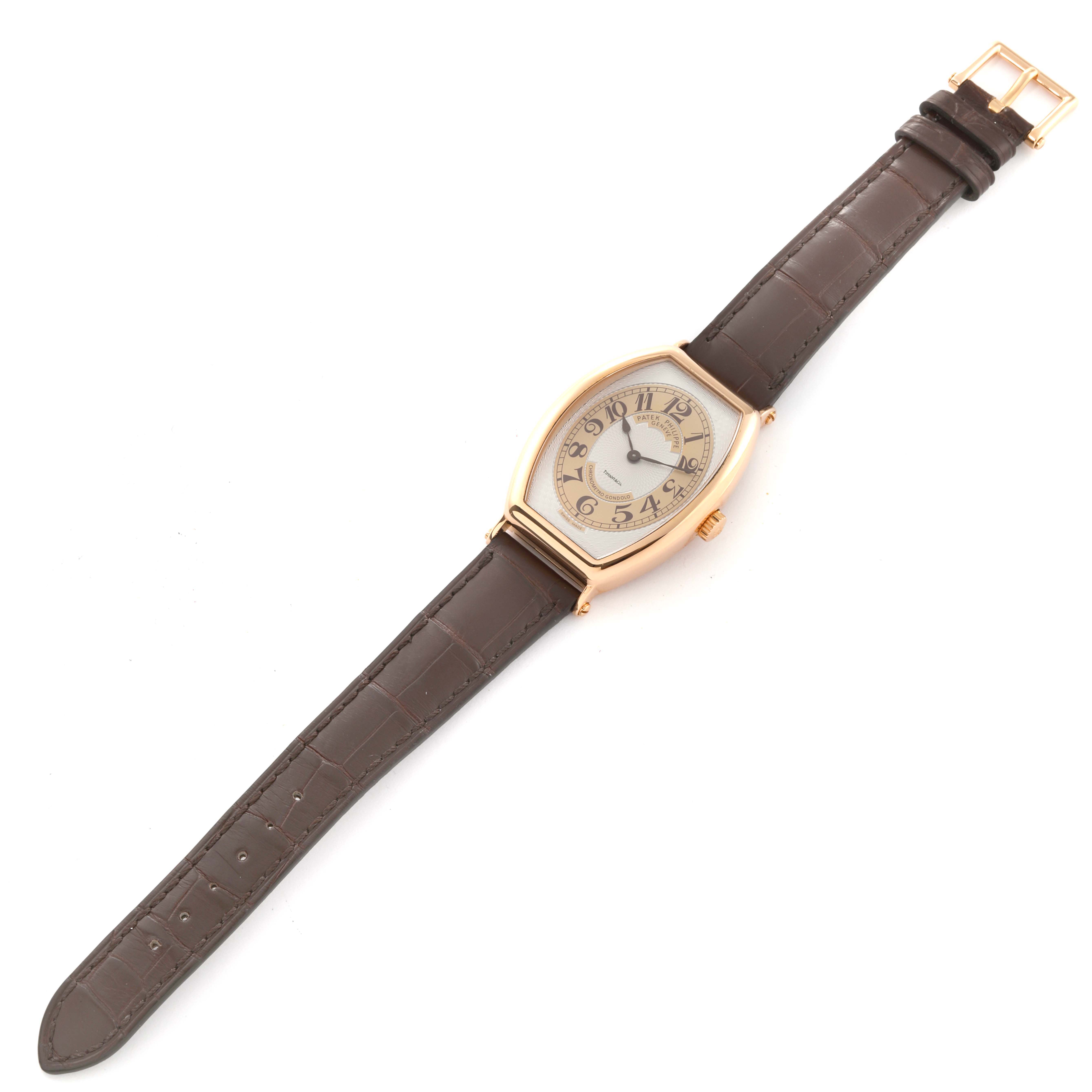 This image shows a Patek Philippe Gondolo 5098R-001 Men's Rose Gold Silver Dial 5098R-001 Men's Rose Gold Silver Dial watch with a clear view of its face, case, strap, and buckle from a top-down angle.
