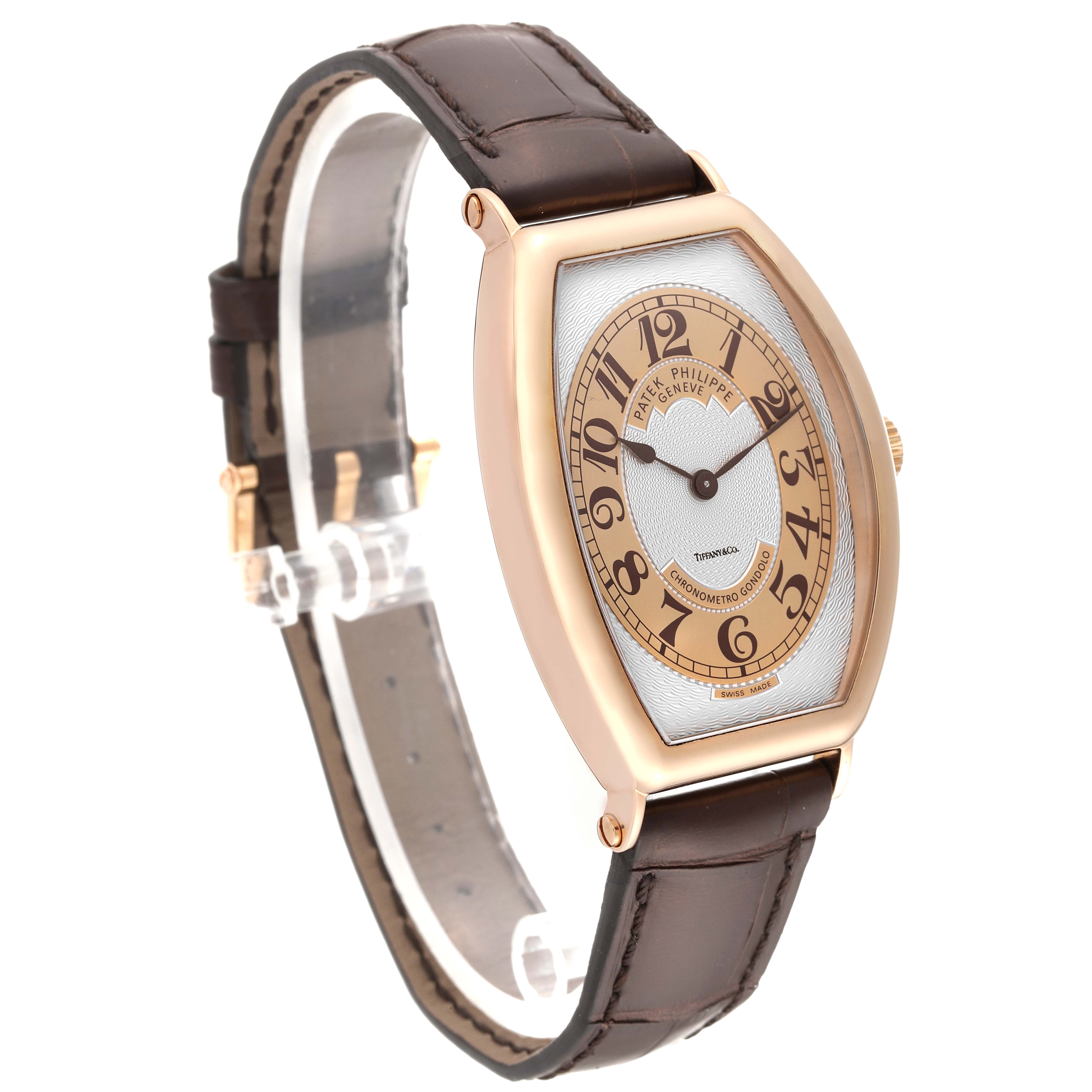 The Patek Philippe Gondolo 5098R-001 Men's Rose Gold Silver Dial 5098R-001 Men's Rose Gold Silver Dial watch is shown at an angled front view, capturing the face, brown strap, and gold-toned case.