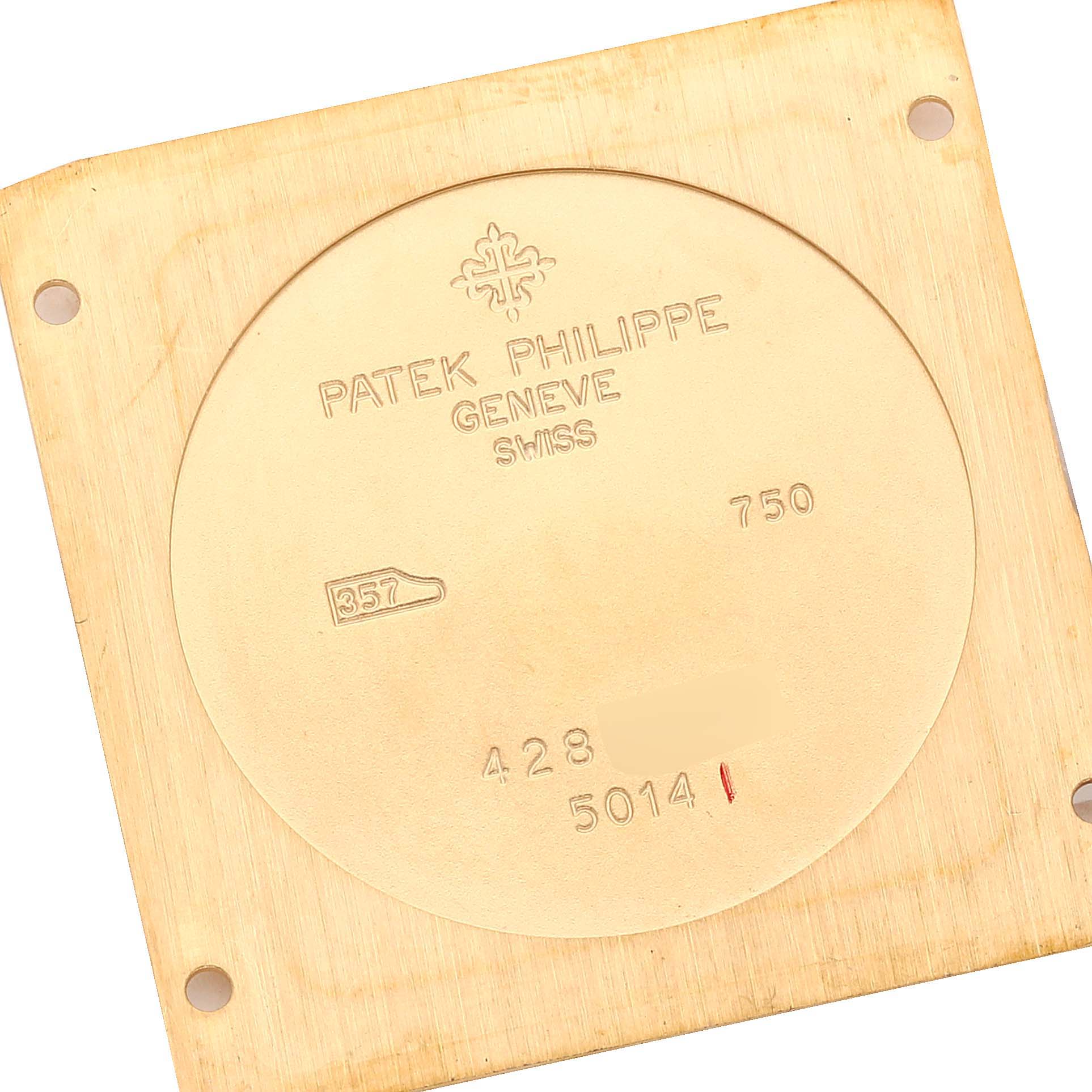 This image shows the case back of a Patek Philippe Gondolo 5014J Men's Yellow Gold Black Dial 5014J Men's Yellow Gold Black Dial model, specifically focusing on its inscriptions.