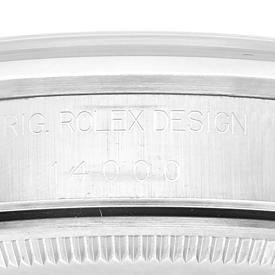 This is a close-up view of the engraved side of the bezel of a Rolex Air-King 14000 Men's Stainless Steel Blue Dial 14000 Men's Stainless Steel Blue Dial watch model.