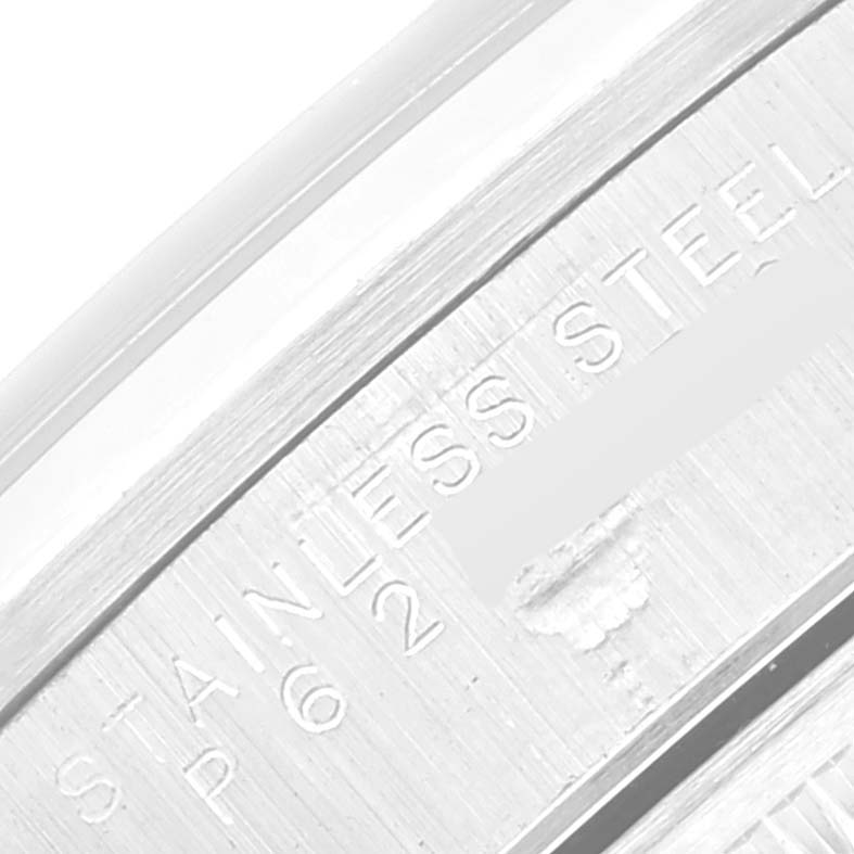 The image shows a close-up view of the engravings on the stainless steel casing of a Rolex Date 15200 Men's Stainless Steel Black Dial 15200 Men's Stainless Steel Black Dial watch.