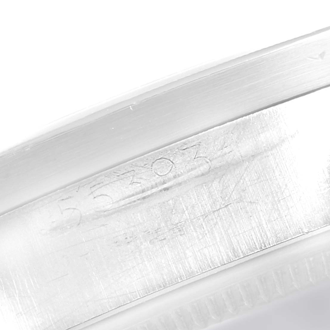 The image shows the serial number engraving on the side of a Rolex Vintage Collection 1501 Men
s Stainless Steel Blue Dial 1501 Men
s Stainless Steel Blue Dial watch case.