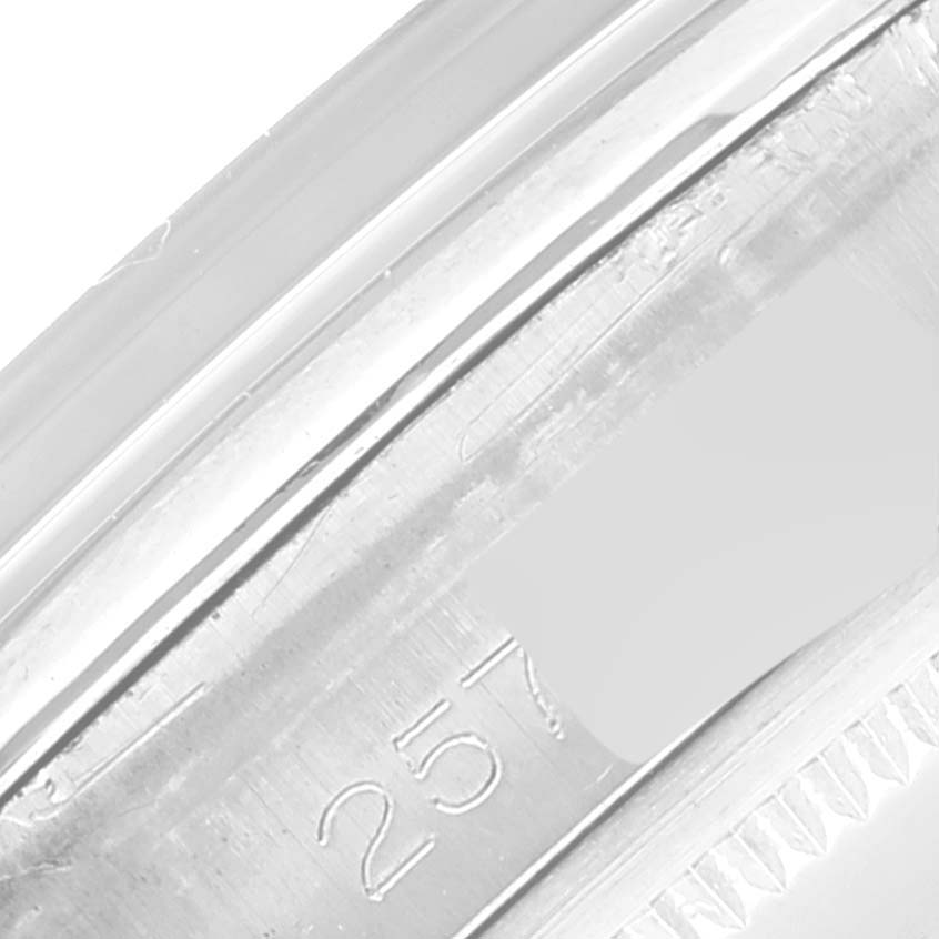 This is a close-up image showing part of the serial number engraving on the side case of the Rolex Vintage Collection 1500 Men's Stainless Steel Grey Dial 1500 Men's Stainless Steel Grey Dial watch.