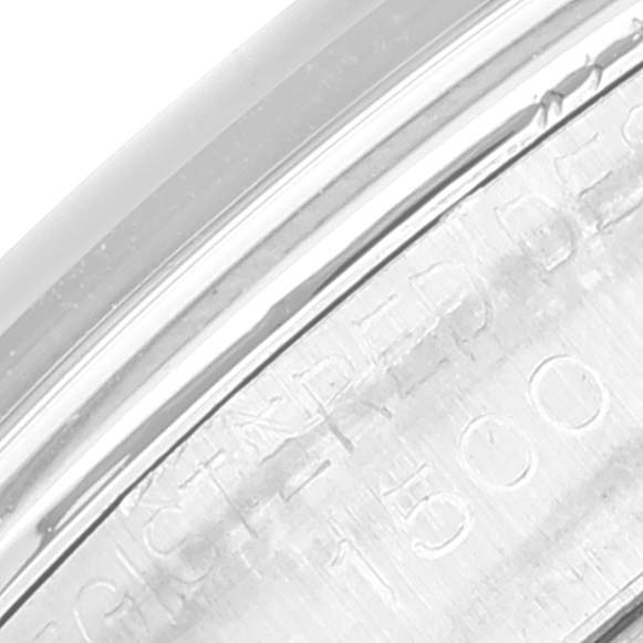 The image shows a close-up of a partial engraving on the side of a Rolex Vintage Collection 1500 Men's Stainless Steel Grey Dial 1500 Men's Stainless Steel Grey Dial watch case.