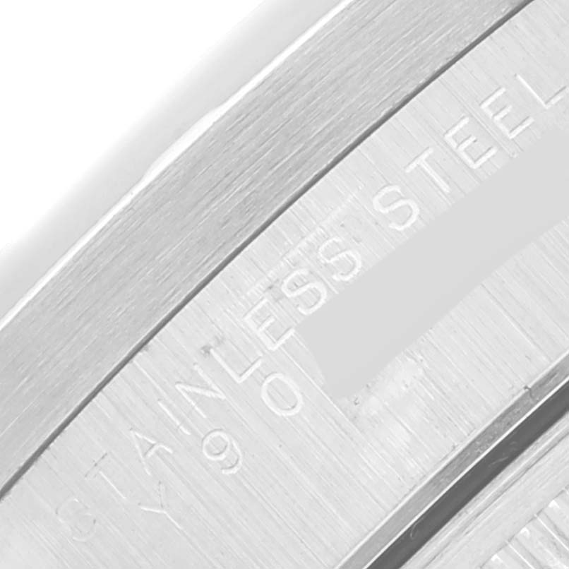 This close-up shows the inner case back inscription of the Rolex Date 15210 Men's Stainless Steel Silver Dial 15210 Men's Stainless Steel Silver Dial model watch, highlighting "STAINLESS STEEL."