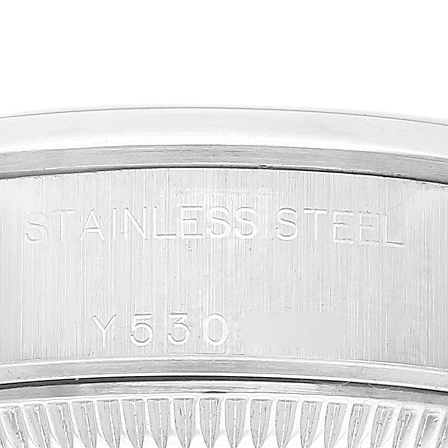 This image shows a close-up of the stainless steel casing and part of the fluted bezel of a Rolex Date 79160 Women
s Stainless Steel White Dial 79160 Women
s Stainless Steel White Dial model watch.
