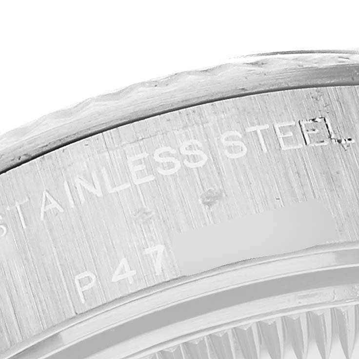 This is a close-up angle showing a stainless steel component of the Rolex Datejust 79174 Women's Stainless Steel Silver Dial 79174 Women's Stainless Steel Silver Dial watch with "STAINLESS STEEL" engraved on it.