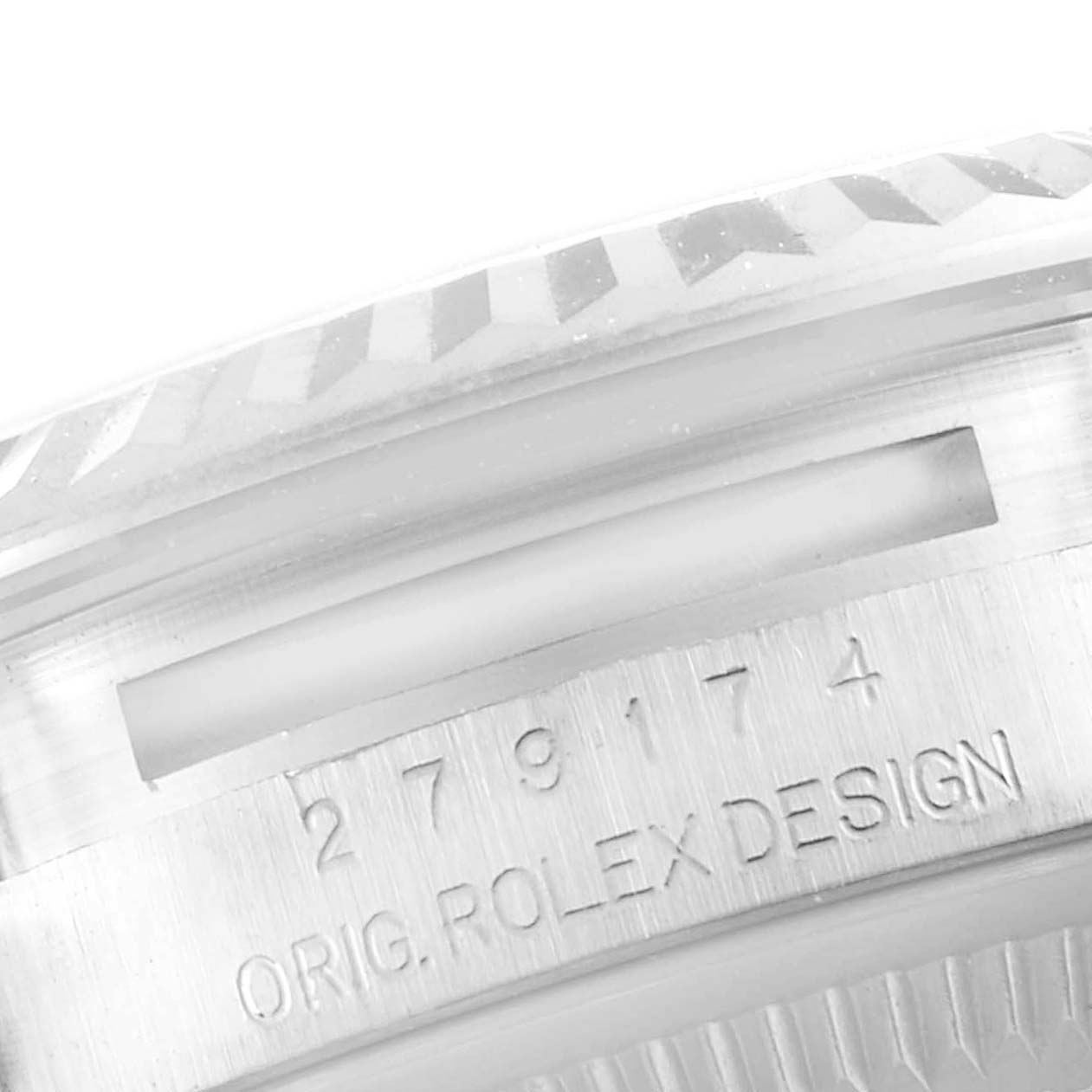 This image shows an angled close-up of the Rolex Datejust 279174 Women's Stainless Steel Pink Dial 279174 Women's Stainless Steel Pink Dial model, focusing on the serial number and engraved "ORIG. ROLEX DESIGN."