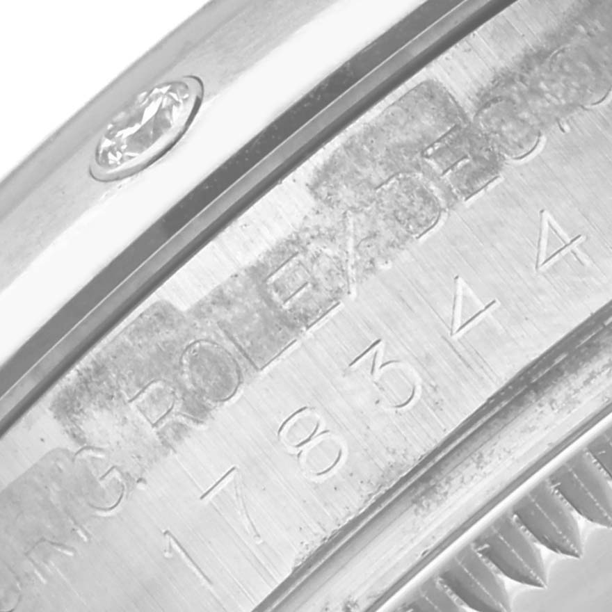 Close-up view of the serial engraving on the inner case and the diamond marker of a Rolex Datejust 178344 Women's Stainless Steel White Dial 178344 Women's Stainless Steel White Dial watch.