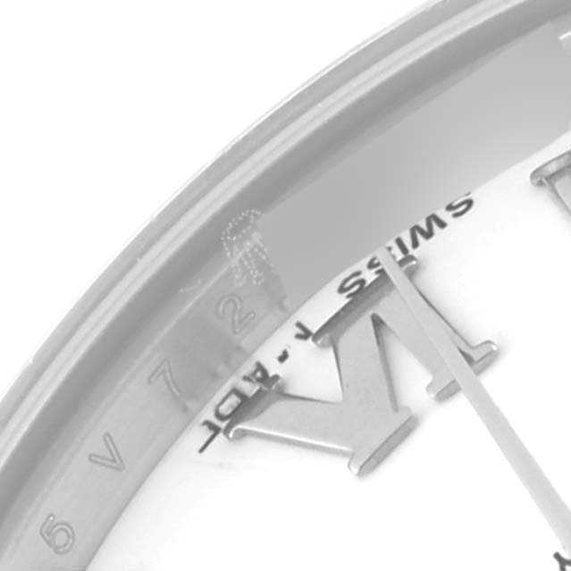This close-up image of the Rolex Datejust 178344 Women's Stainless Steel White Dial 178344 Women's Stainless Steel White Dial watch focuses on part of the dial and the rehaut, showing Roman numerals and the word "SWISS."