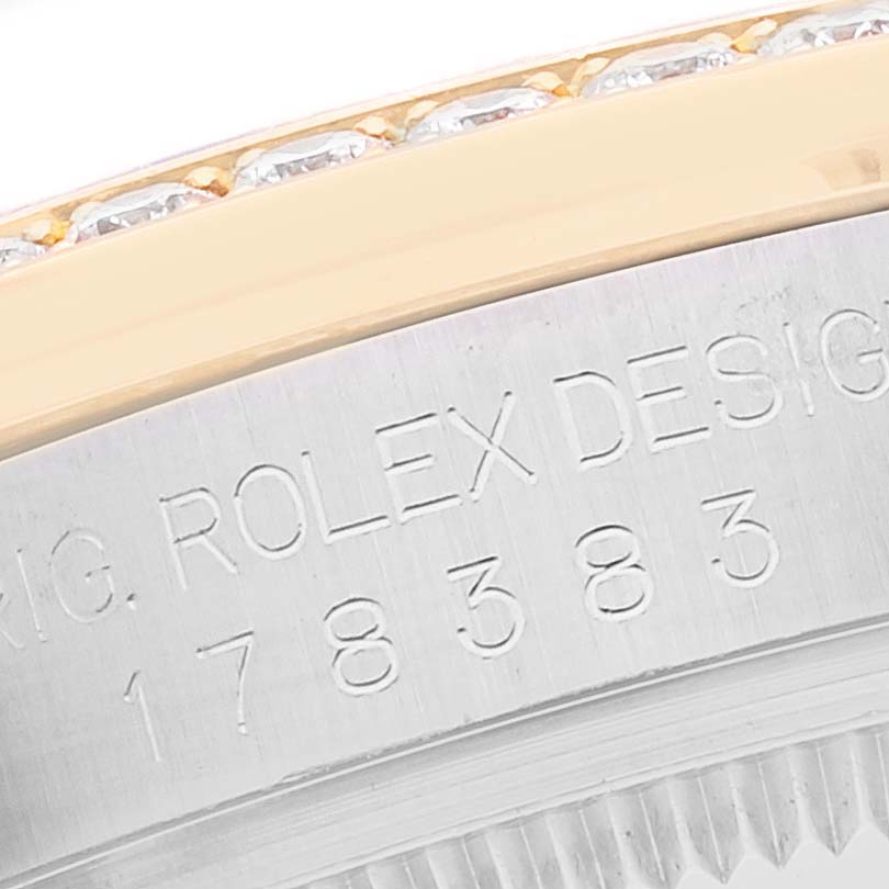 This image shows a close-up of the bezel and engraved details on the case of a Rolex Mid-Size 178383 Women
s Steel and Gold (two tone) Silver Dial 178383 Women
s Steel and Gold (two tone) Silver Dial watch model 178383.