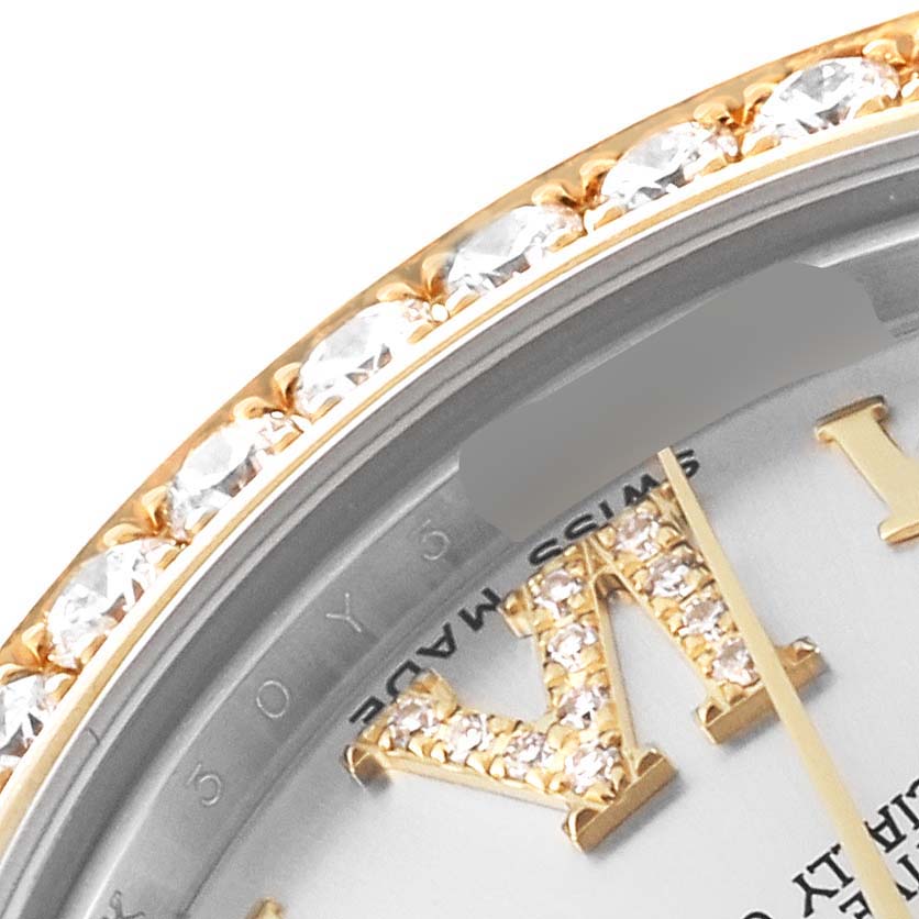 This close-up of a Rolex Mid-Size 178383 Women
s Steel and Gold (two tone) Silver Dial 178383 Women
s Steel and Gold (two tone) Silver Dial model shows the bejeweled bezel and part of the dial with diamond-set markers.