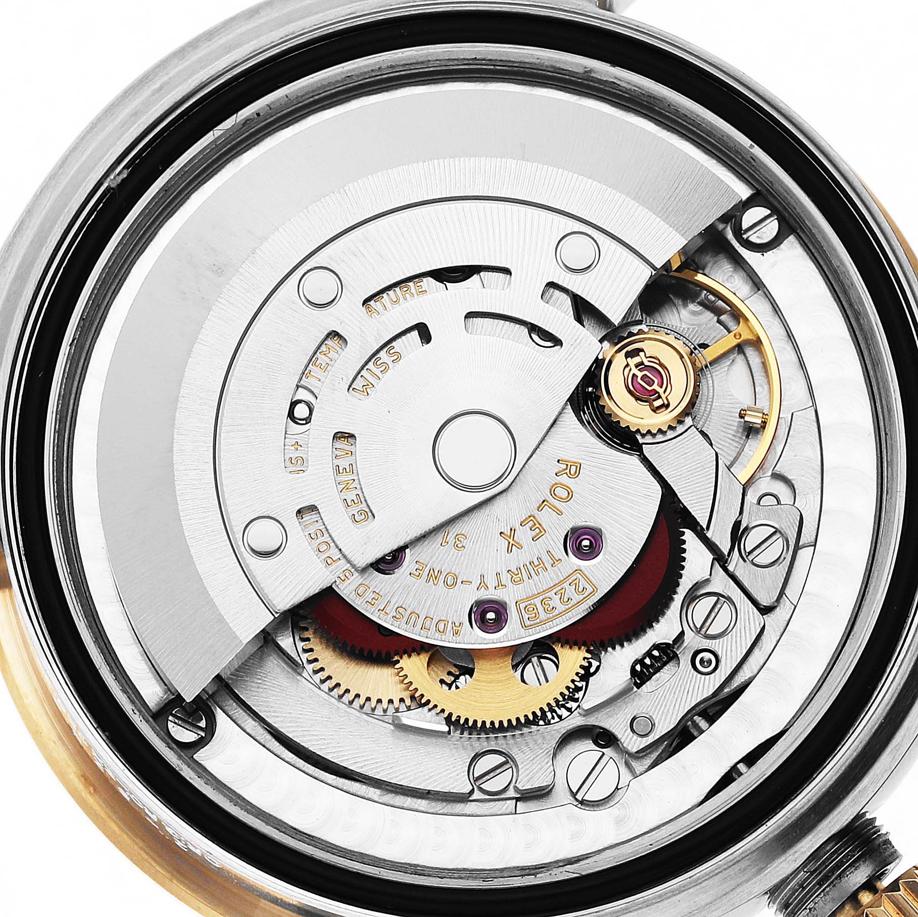 The image shows the internal mechanism of a Rolex Mid-Size 278273 Women's Steel and Gold (two tone) Green Dial model watch from a top-down angle, highlighting gears and movement parts.