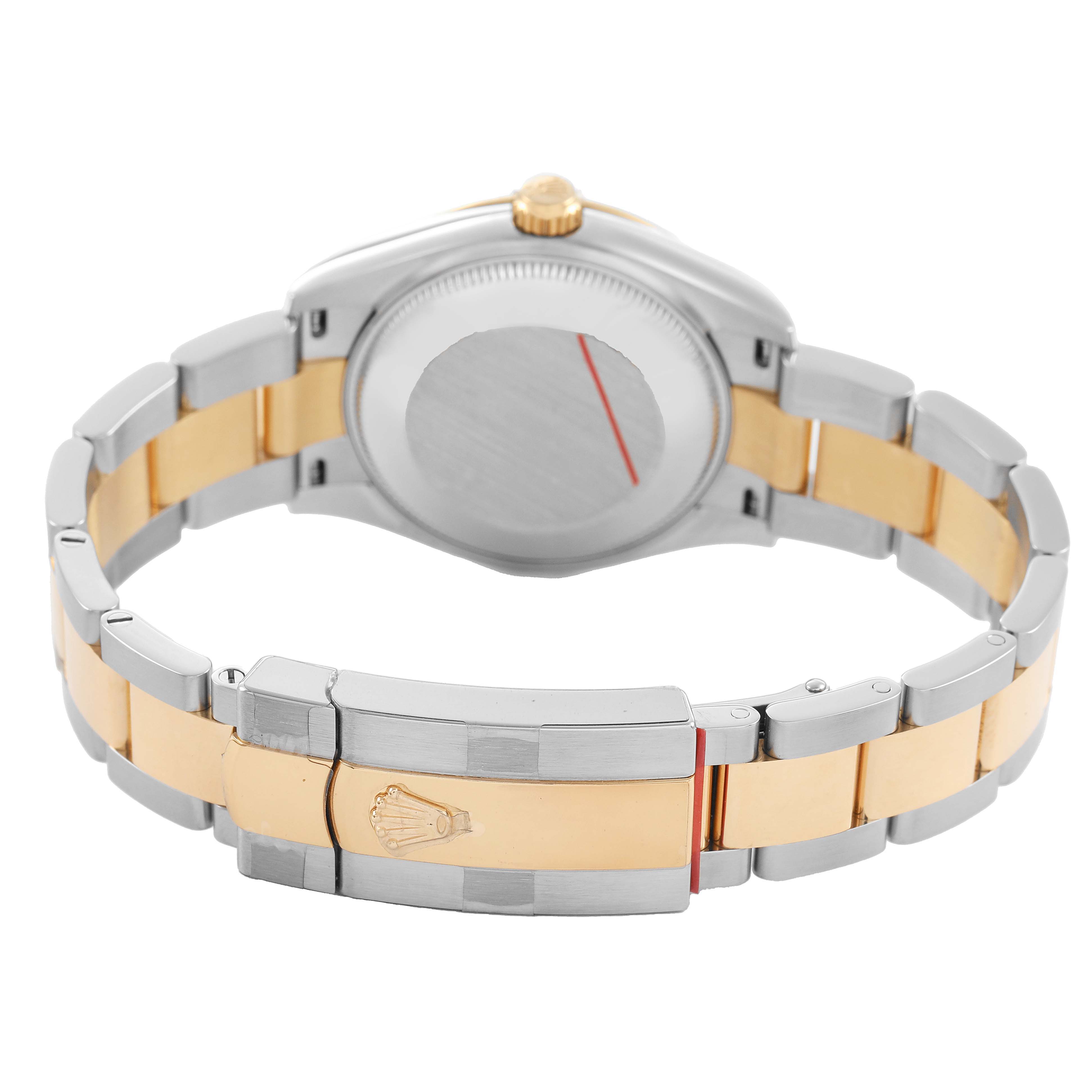 The image shows the back view of a mid-size Rolex watch, highlighting the bi-color bracelet and clasp with the Rolex logo.