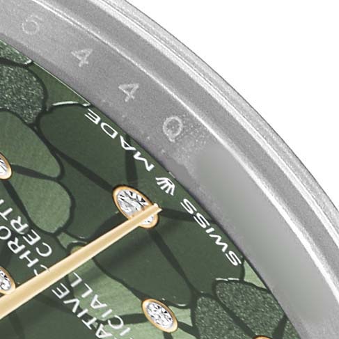 The image shows a close-up of the Rolex Mid-Size 278273 Women's Steel and Gold (two tone) Green Dial watch dial, highlighting the green textured design, diamond markers, and part of the bezel.