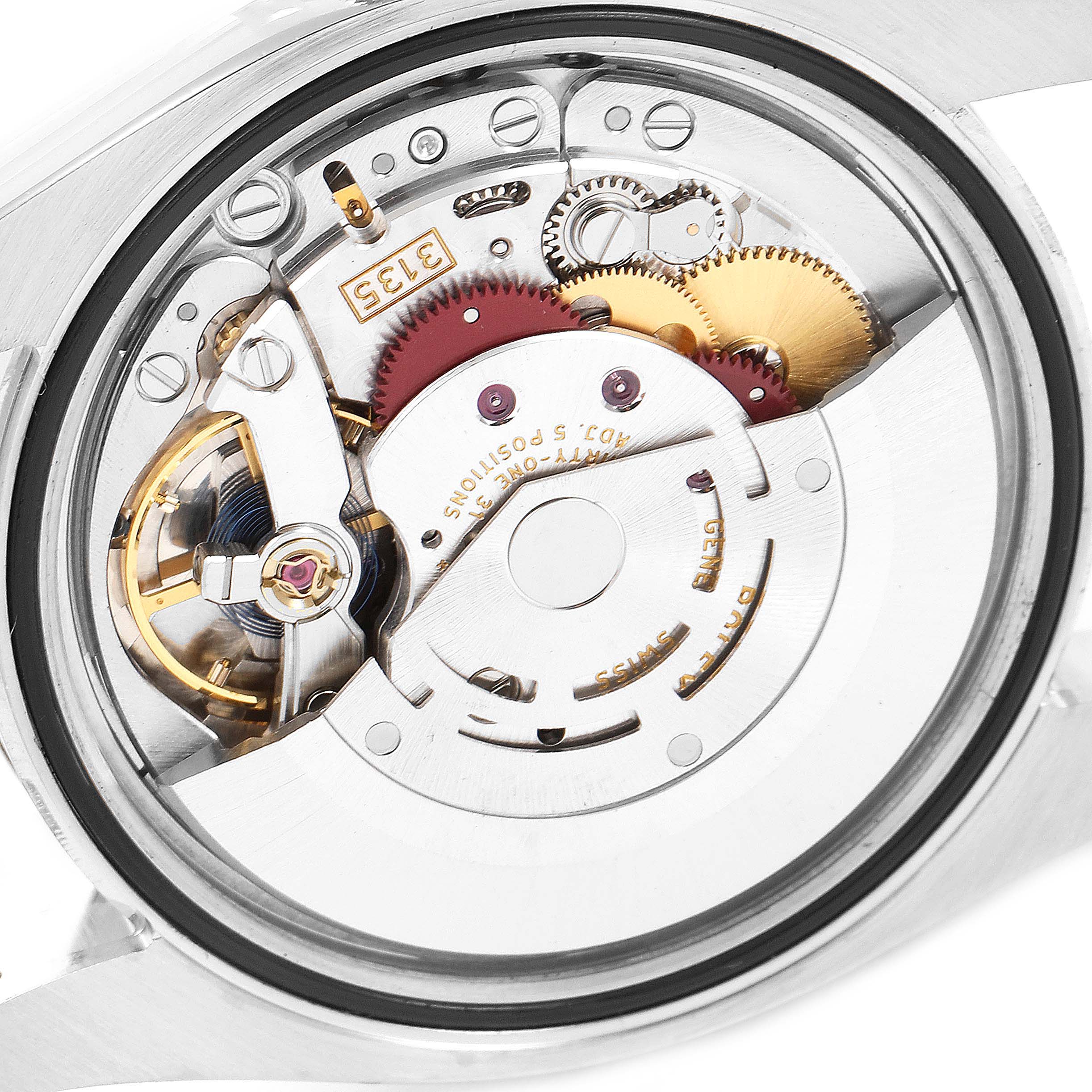 This image shows the intricate inner mechanical movement of a Rolex Datejust 116233 Men's Steel and Gold (two tone) Champagne Dial 116233 Men's Steel and Gold (two tone) Champagne Dial watch from a close-up angle.