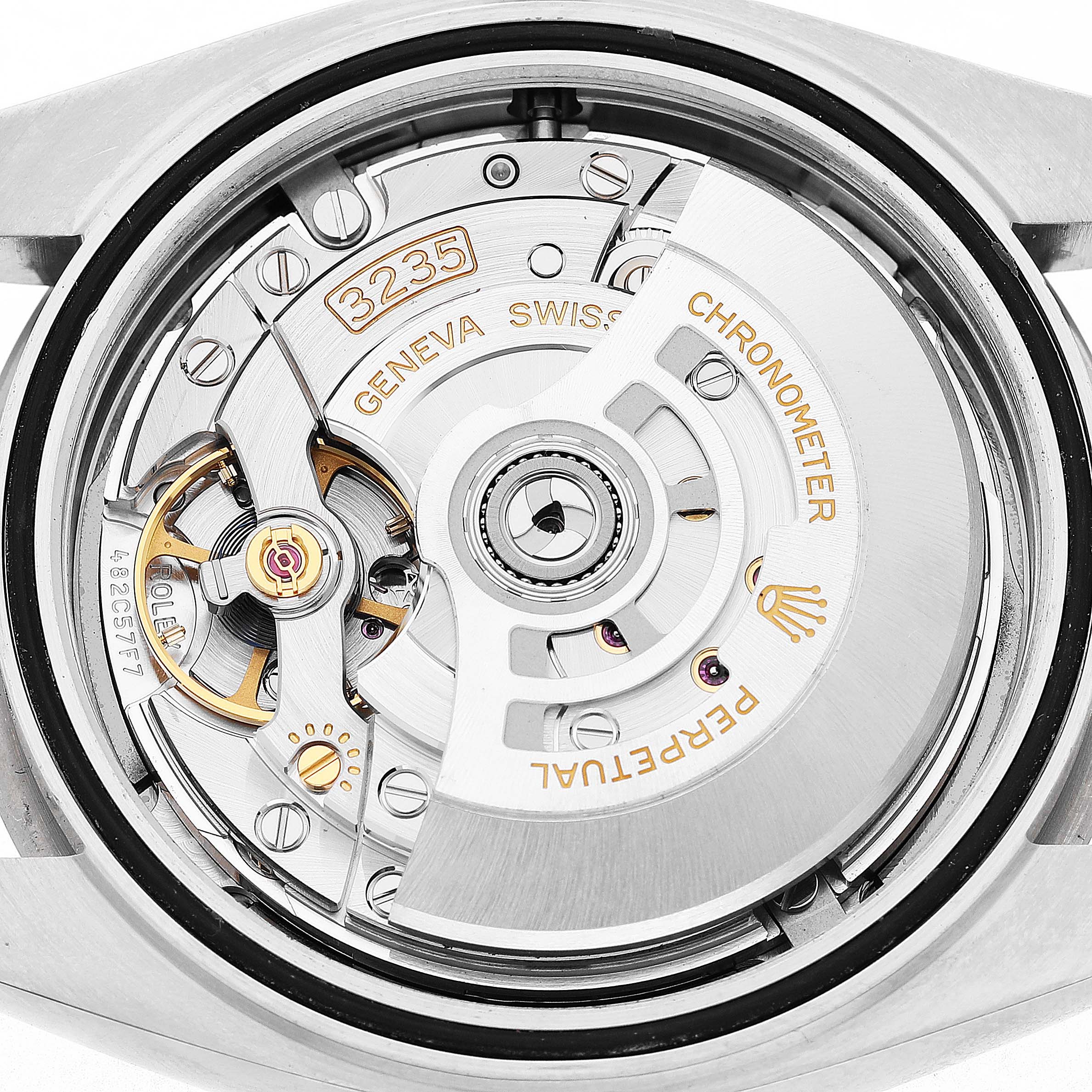 The image shows the movement of the Rolex Datejust 41 126334 Men's Stainless Steel Grey Dial, highlighting the rotor and intricate mechanical parts.