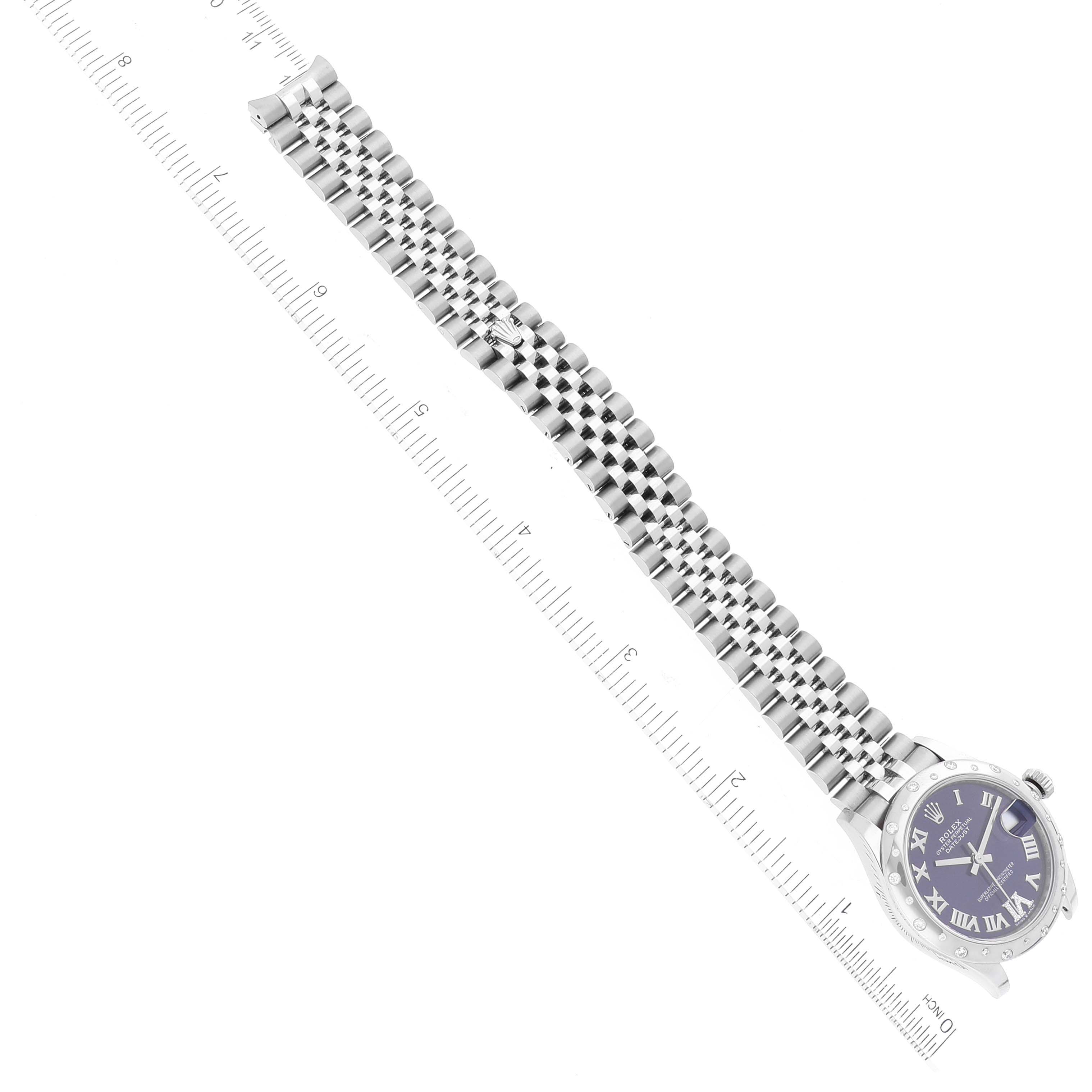 The image shows a Mid-Size Rolex watch laid flat, displaying the face, bezel, and full length of the bracelet with a ruler below it.