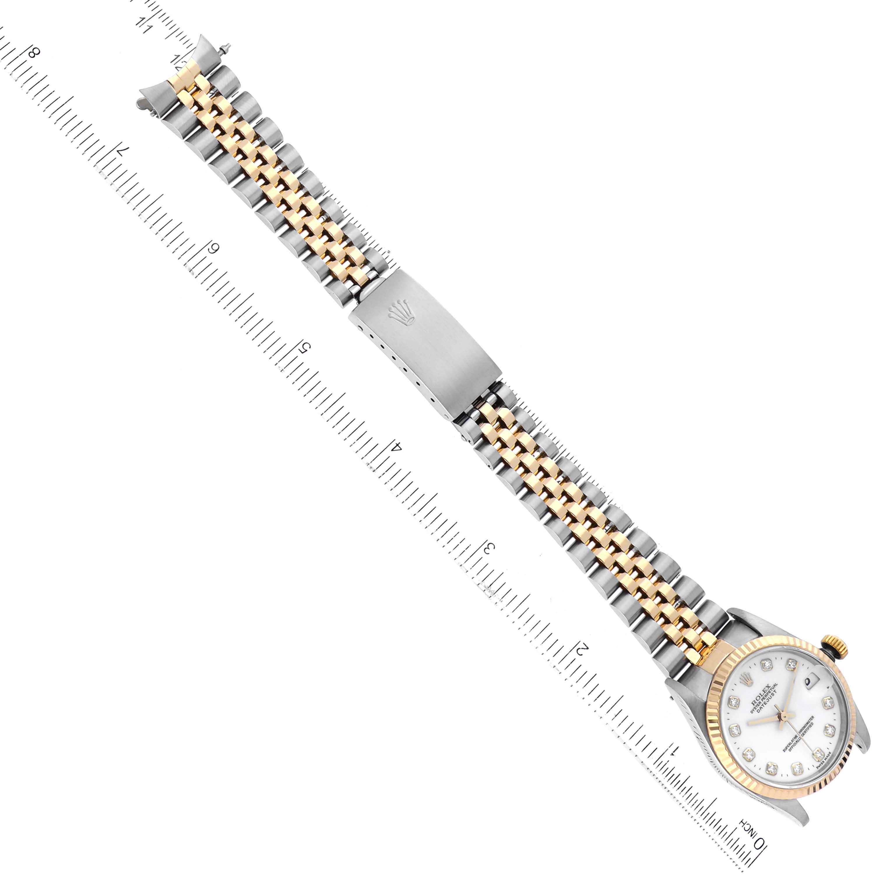 This image shows the Rolex Mid-Size 68273 Women
s Steel and Gold (two tone) White Dial 68273 Women
s Steel and Gold (two tone) White Dial model watch from an overhead angle, highlighting the full bracelet and face with a ruler for scale.