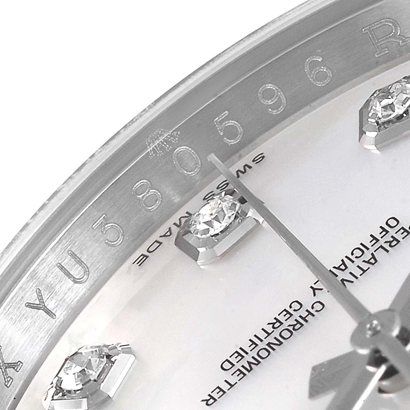 This image shows a close-up of the Rolex Datejust 116244 Men
s Stainless Steel Mother of Pearl Dial 116244 Men
s Stainless Steel Mother of Pearl Dial watch dial, highlighting the serial number and diamond hour markers.