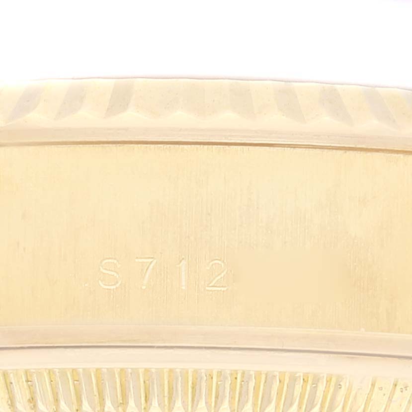 The close-up image shows a portion of the bezel and case with the engraved serial number of the Rolex President 69178 Women's Yellow Gold Champagne Dial 69178 Women's Yellow Gold Champagne Dial watch.