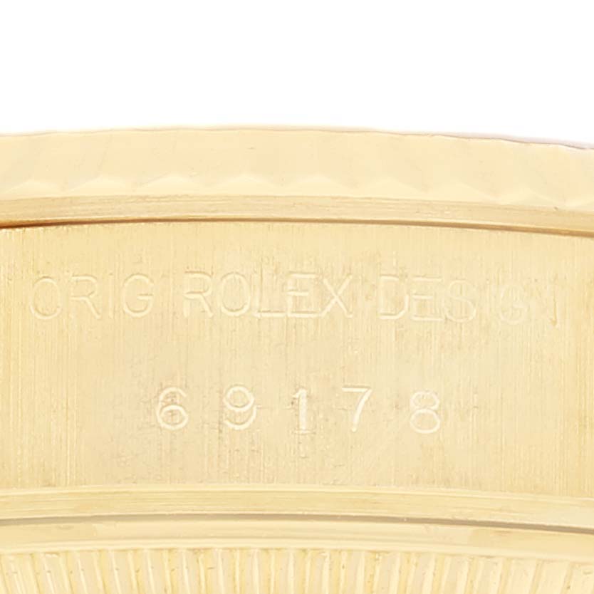 The image shows a close-up of the side of the Rolex President 69178 Women's Yellow Gold Champagne Dial 69178 Women's Yellow Gold Champagne Dial watch, highlighting the model number engraving.