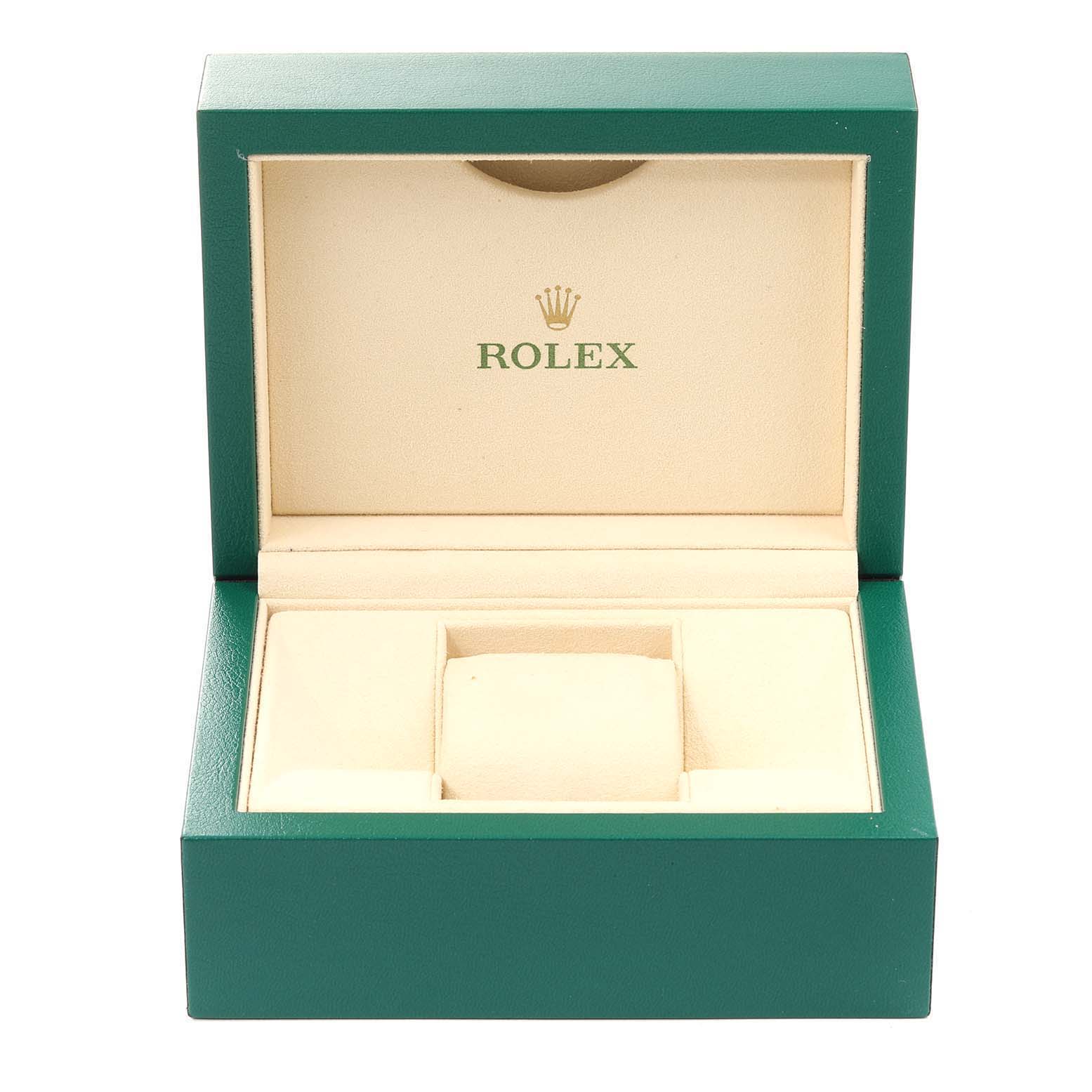This is an open green watch box for a Rolex Datejust 116234 Men
s Stainless Steel Black Dial 116234 Men
s Stainless Steel Black Dial model, showcasing the interior cushion and branding.
