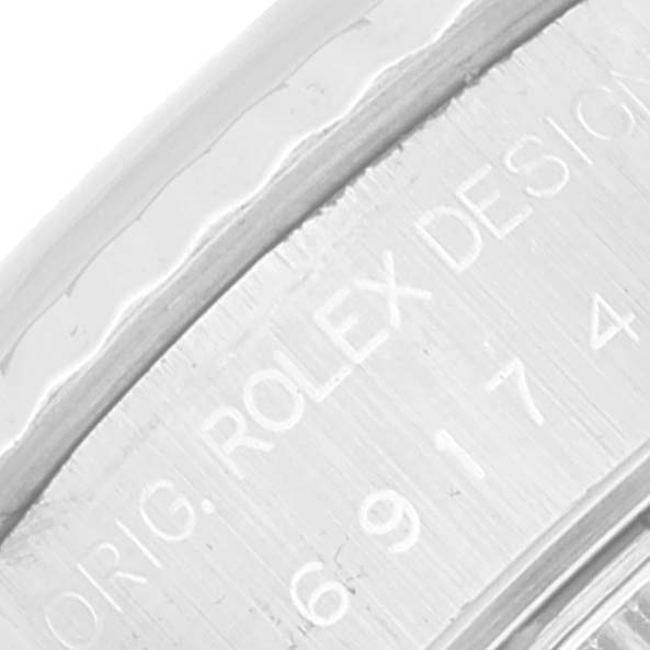 The image shows a close-up of the inscription on the side of a Rolex Datejust 69174 Women's Stainless Steel Silver Dial 69174 Women's Stainless Steel Silver Dial watch case.
