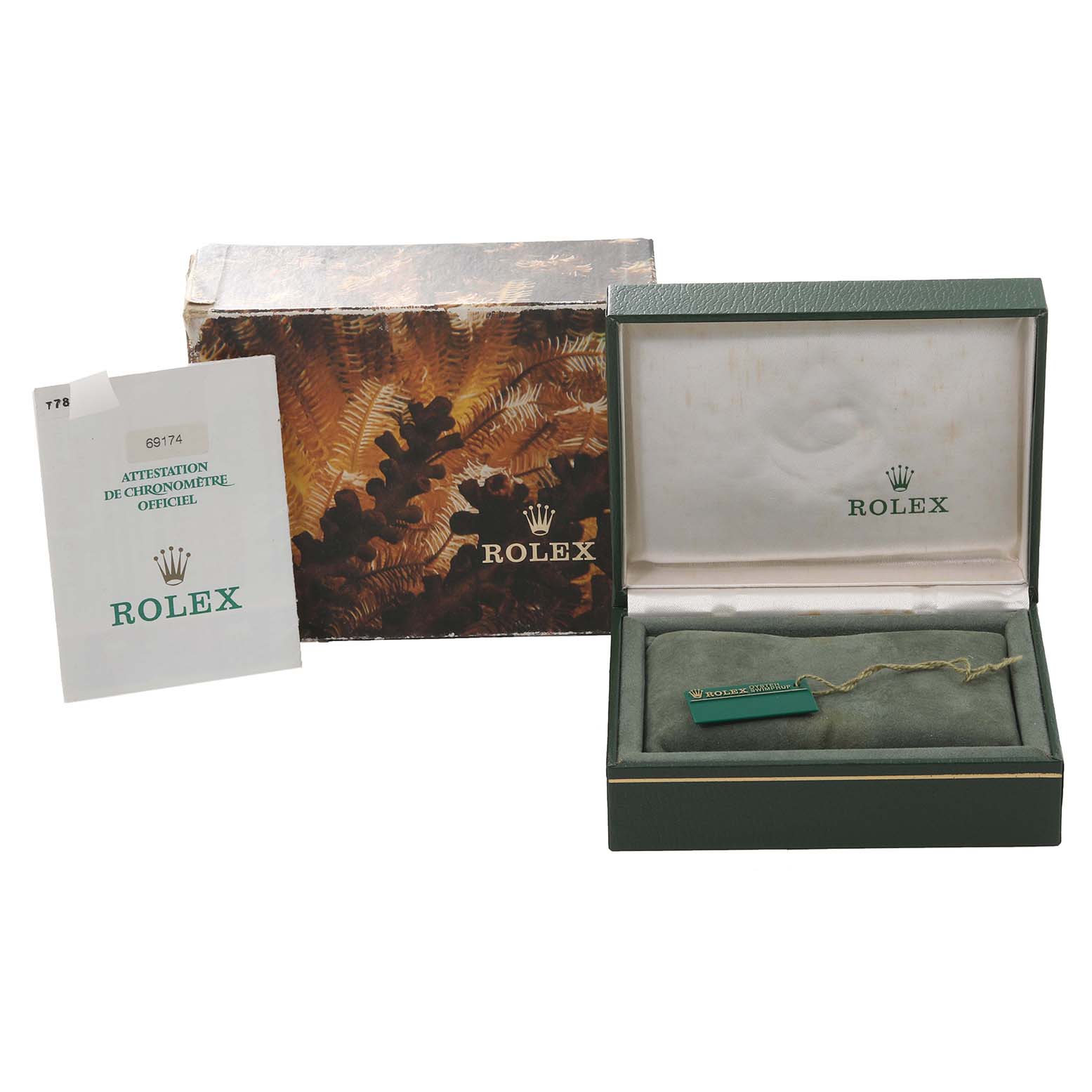 The image shows the packaging, certificate, and tag for a Rolex Datejust 69174 Women's Stainless Steel Silver Dial 69174 Women's Stainless Steel Silver Dial watch, with the watch box partially open.