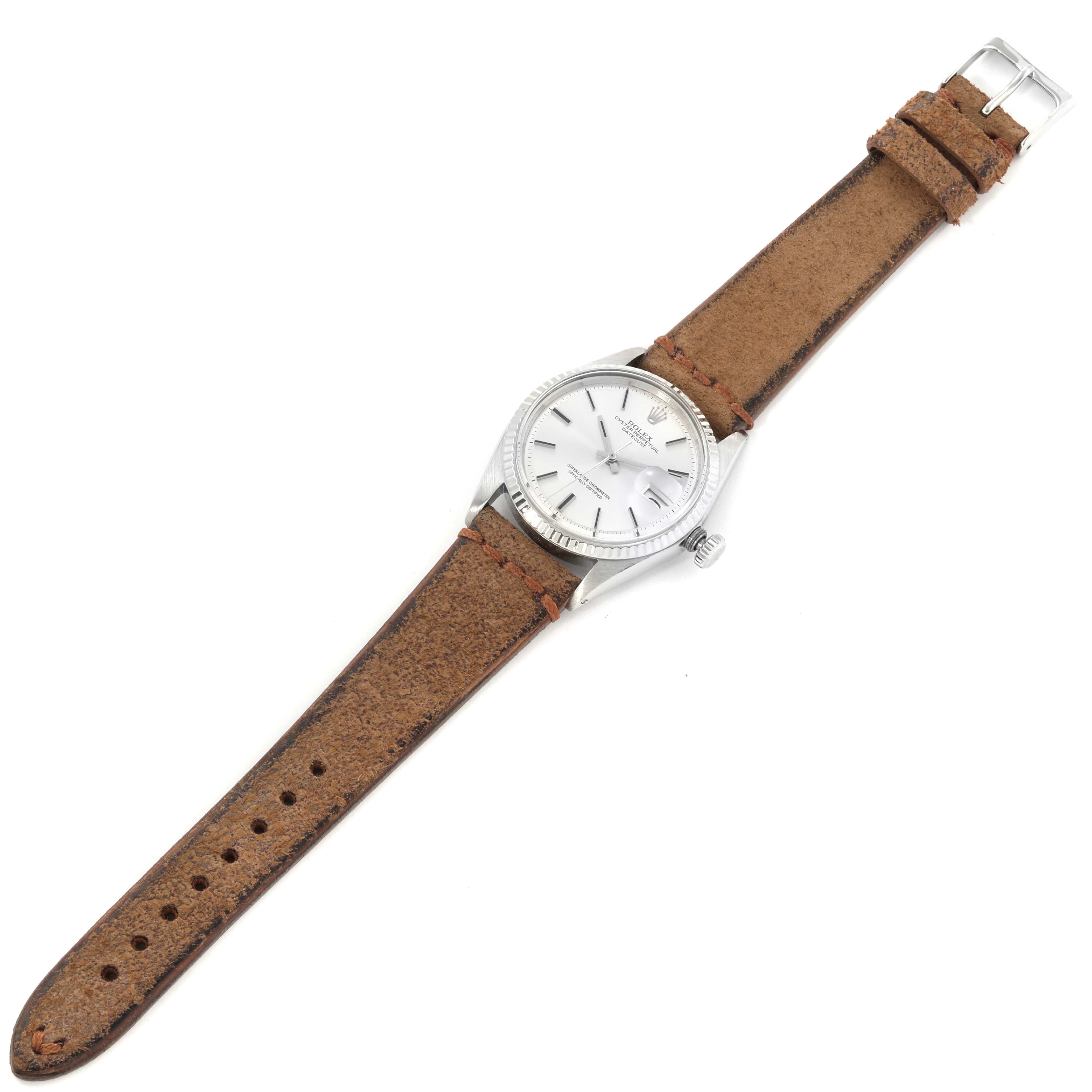 The image shows a Rolex Vintage Collection 1601 Men's Stainless Steel Silver Dial 1601 Men's Stainless Steel Silver Dial watch, featuring a silver dial and brown leather strap, viewed from a top-down angle.