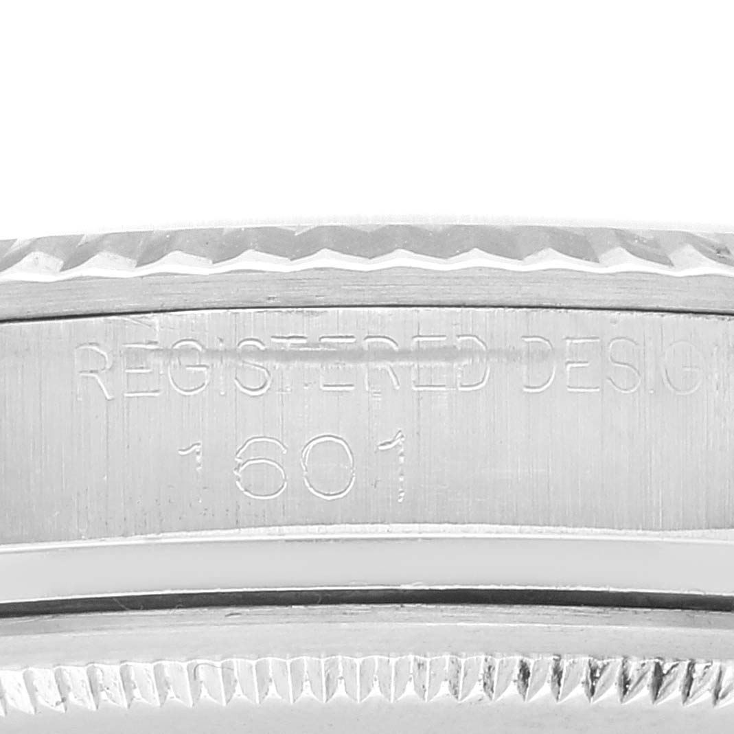 Close-up of the case side of the Rolex Vintage Collection 1601 Men's Stainless Steel Silver Dial 1601 Men's Stainless Steel Silver Dial model, showing "Registered Design 1601" engraving.