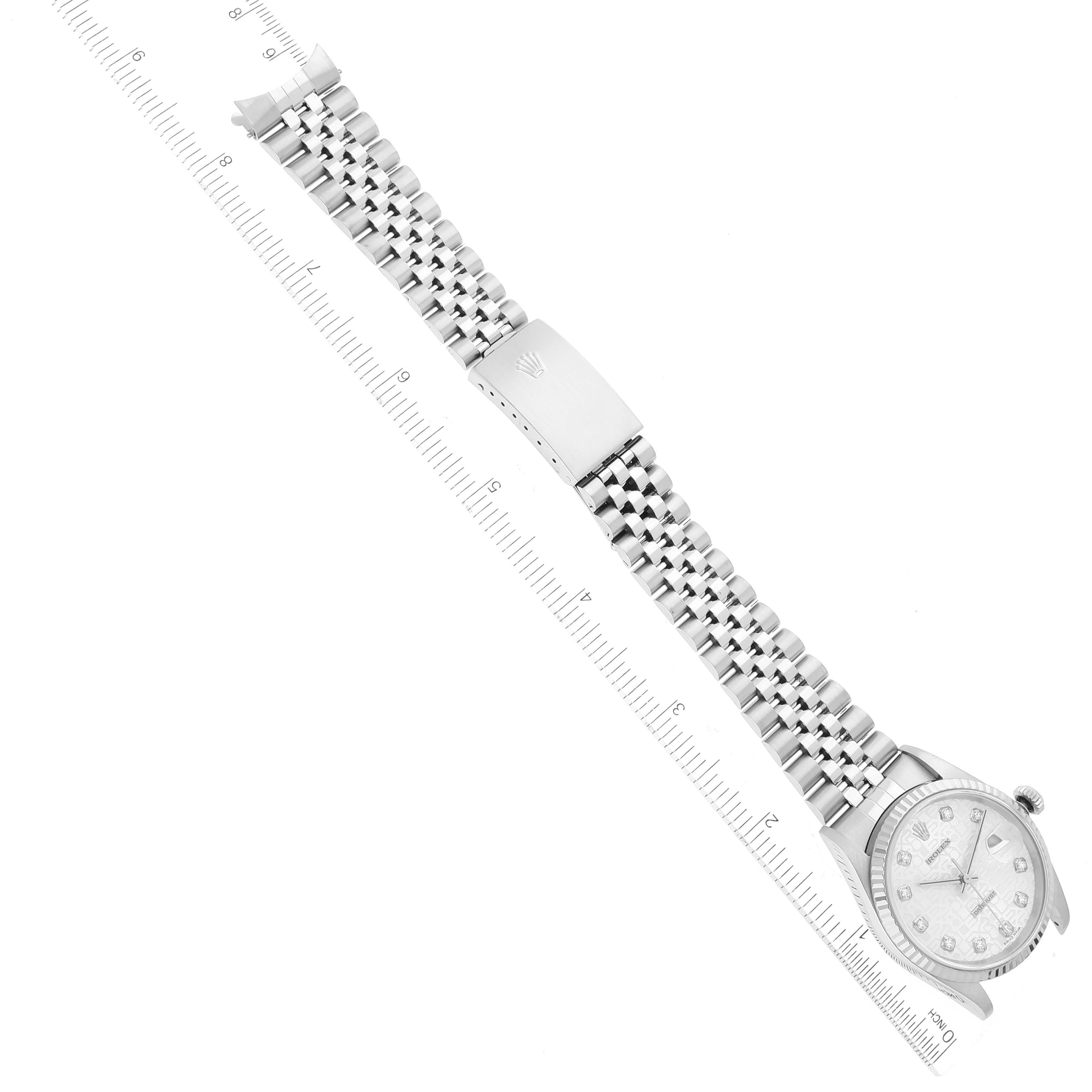 The image shows a top-down view of a Rolex Datejust 16234 Men's Stainless Steel Silver Dial 16234 Men's Stainless Steel Silver Dial watch, featuring the face, bezel, and metal bracelet against a ruler.